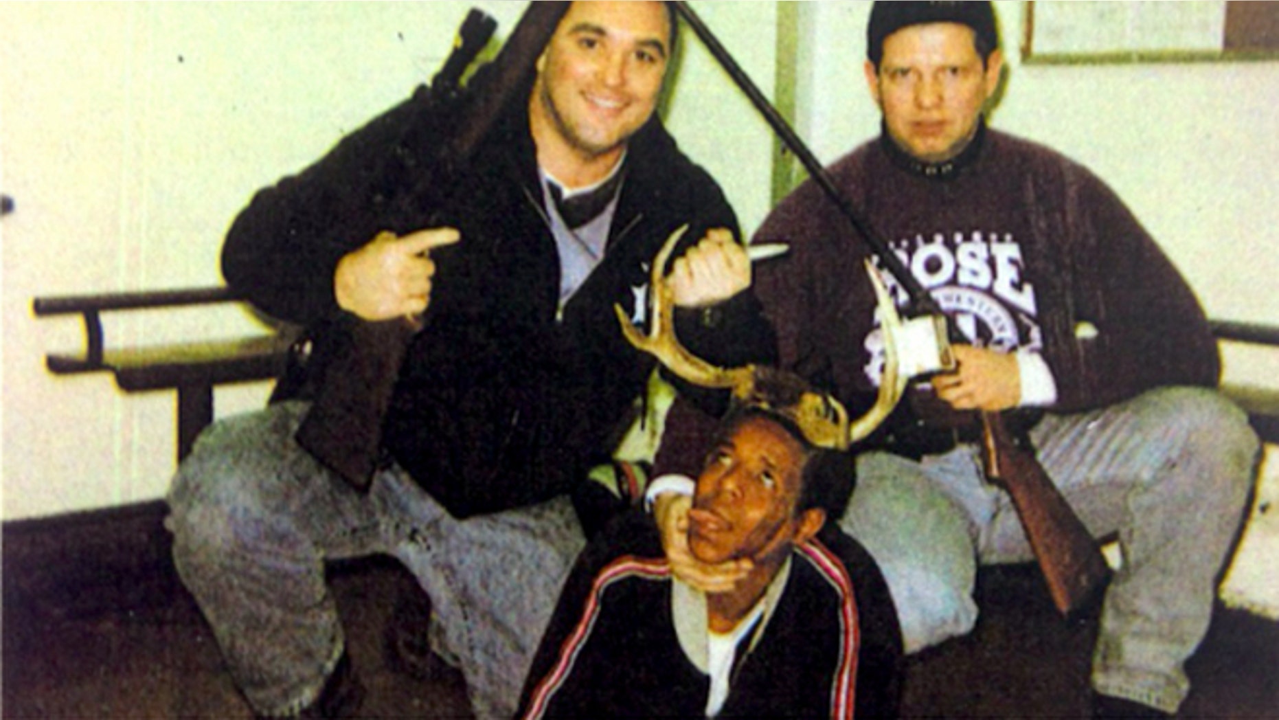 Officers Jerome Finnigan, left, and Tim McDermott with unidentified man