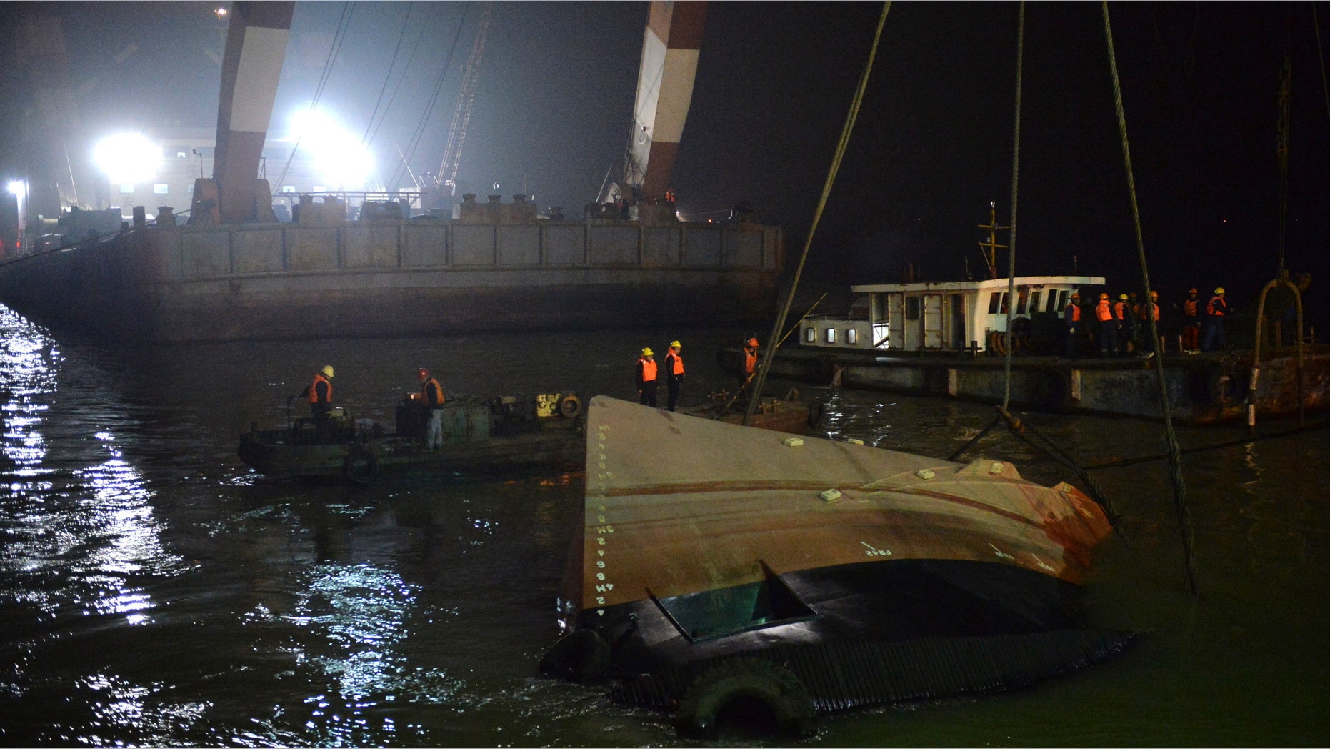 Jan. 16, 2015: Rescuers salvage the wreck after a tug boat sank in the Yangtze River in east China's Jiangsu Province.