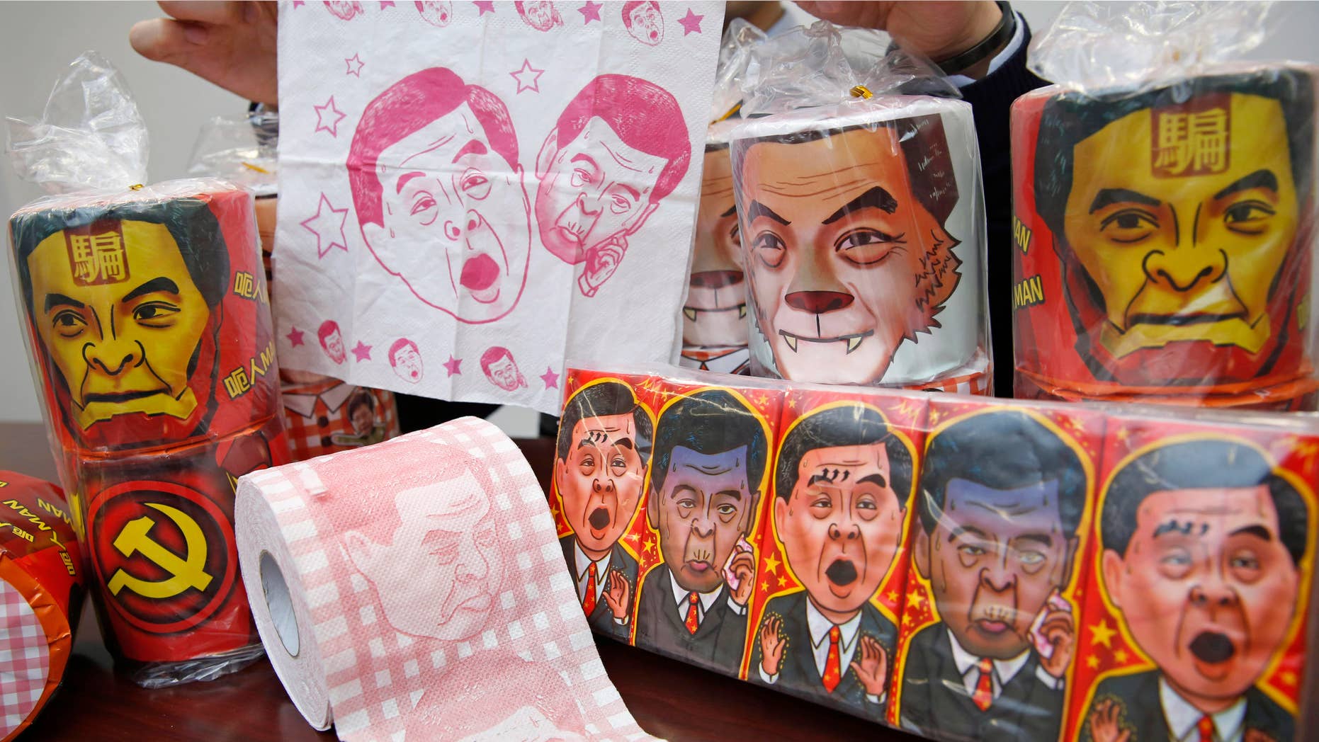 FEb. 7, 2015: olls of toilet paper and packages of tissue paper printed with images of pro-Beijing Hong Kong Chief Executive Leung Chun-ying.