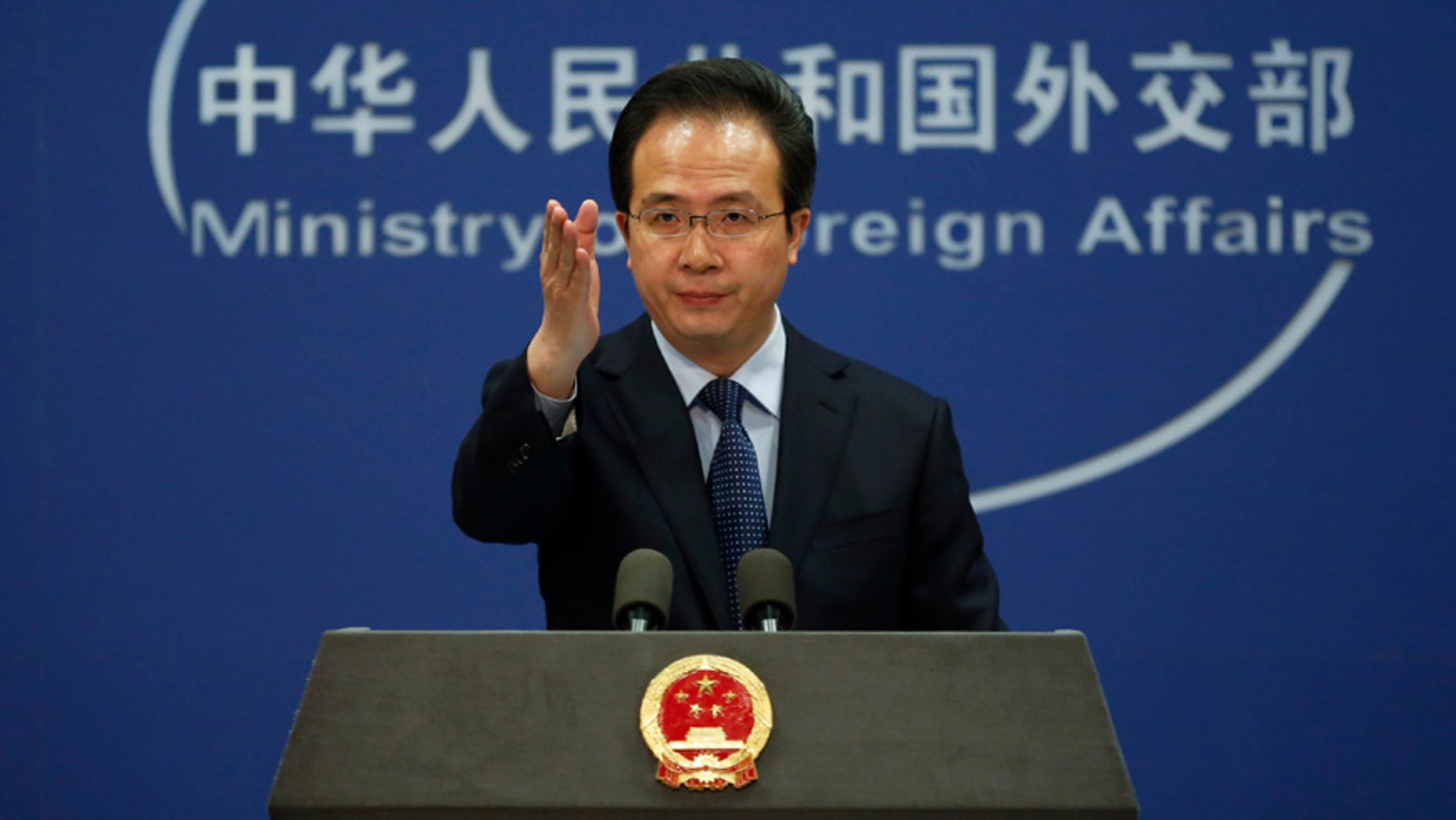 April 5, 2016: China's Foreign Ministry spokesman Hong Lei gestures during a daily briefing at the Ministry of Foreign Affairs office in Beijing.