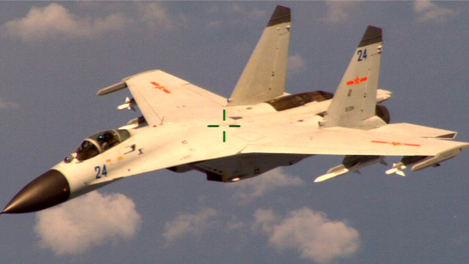 Aug. 19, 2014: This handout photo provided by the Office of the Defense Secretary (OSD), taken shows a Chinese fighter jet that the Obama administration said Friday conducted a "dangerous intercept" of a U.S. Navy surveillance and reconnaissance aircraft off the coast of China in international airspace.