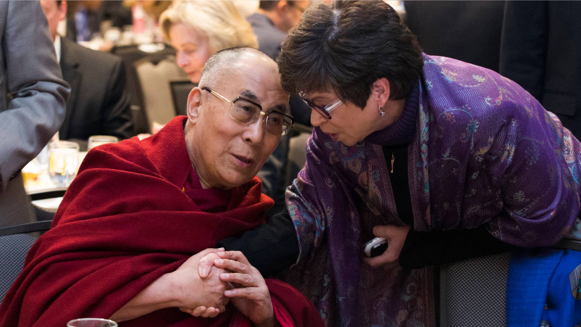 Feb. 5, 2015: Valerie Jarrett, senior adviser to President Barack Obama, right, talks with the Dalai Lama during the National Prayer Breakfast in Washington.