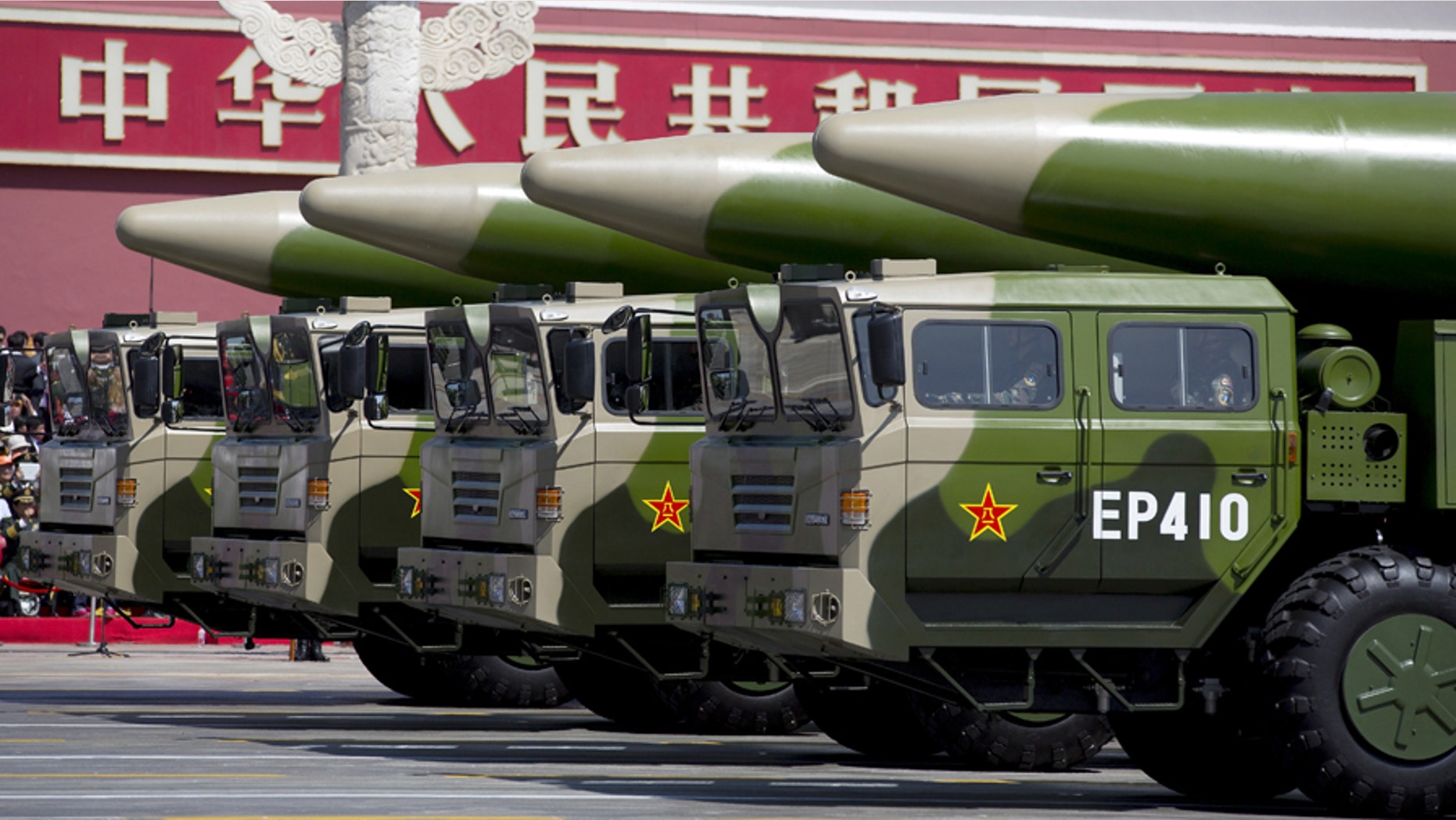 File photo - Military vehicles carrying DF-26 ballistic missiles travel past Tiananmen Gate during a military parade to commemorate the 70th anniversary of the end of World War II in Beijing Thursday Sept. 3, 2015. (REUTERS/Andy Wong/Pool)