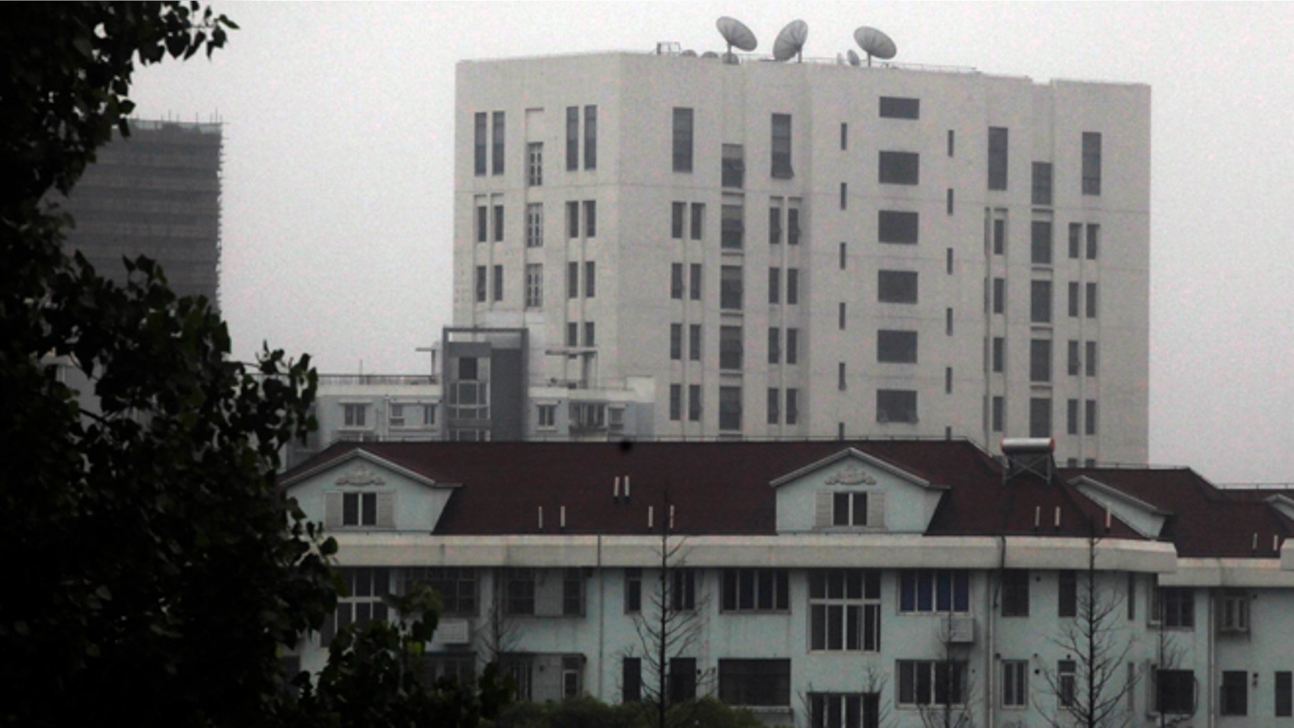 This May 31, 2013 photo shows the building housing Unit 61398 of the Peoples Liberation Army, center top, in the outskirts of Shanghai, China. After years of quiet and largely unsuccessful diplomacy, the U.S. has brought its persistent computer-hacking problems with China into the open, delivering a steady drumbeat of reports accusing Beijings government and military of computer-based attacks against America. Officials say the new strategy may be having some impact.