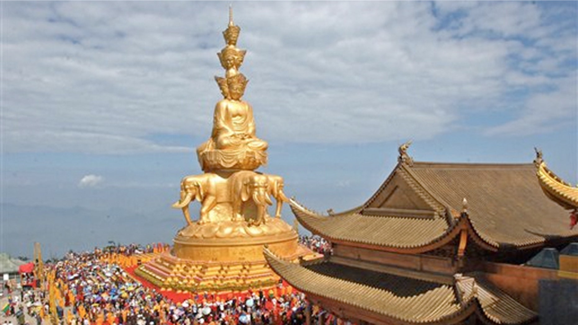 June 18, 2006: Worshippers attend a ceremony at the Jin Ding, or Golden Tip, on Emei Mountains in Emeishan city in southwest China's Sichuan province.