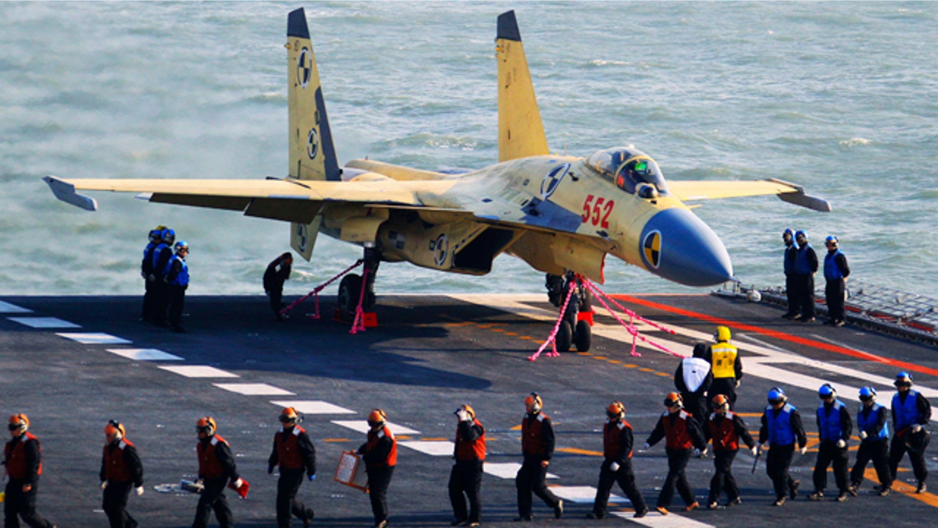 Nov. 25, 2012: This undated photo released by China's Xinhua News Agency, shows a carrier-borne J-15 fighter jet on China's first aircraft carrier, the Liaoning.
