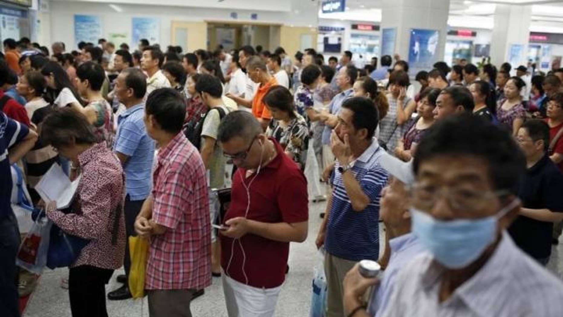 Sept. 2, 2014: People queue at a hospital in Shanghai.