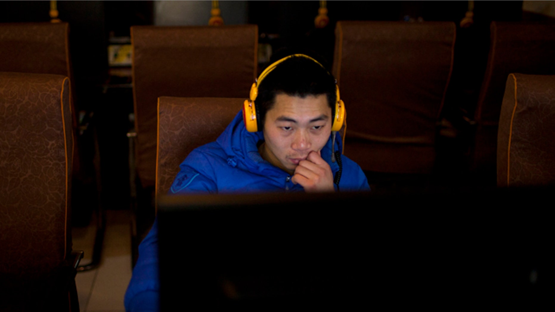 Dec. 28, 2012: A man uses a computer at an internet cafe in central Beijing, China.