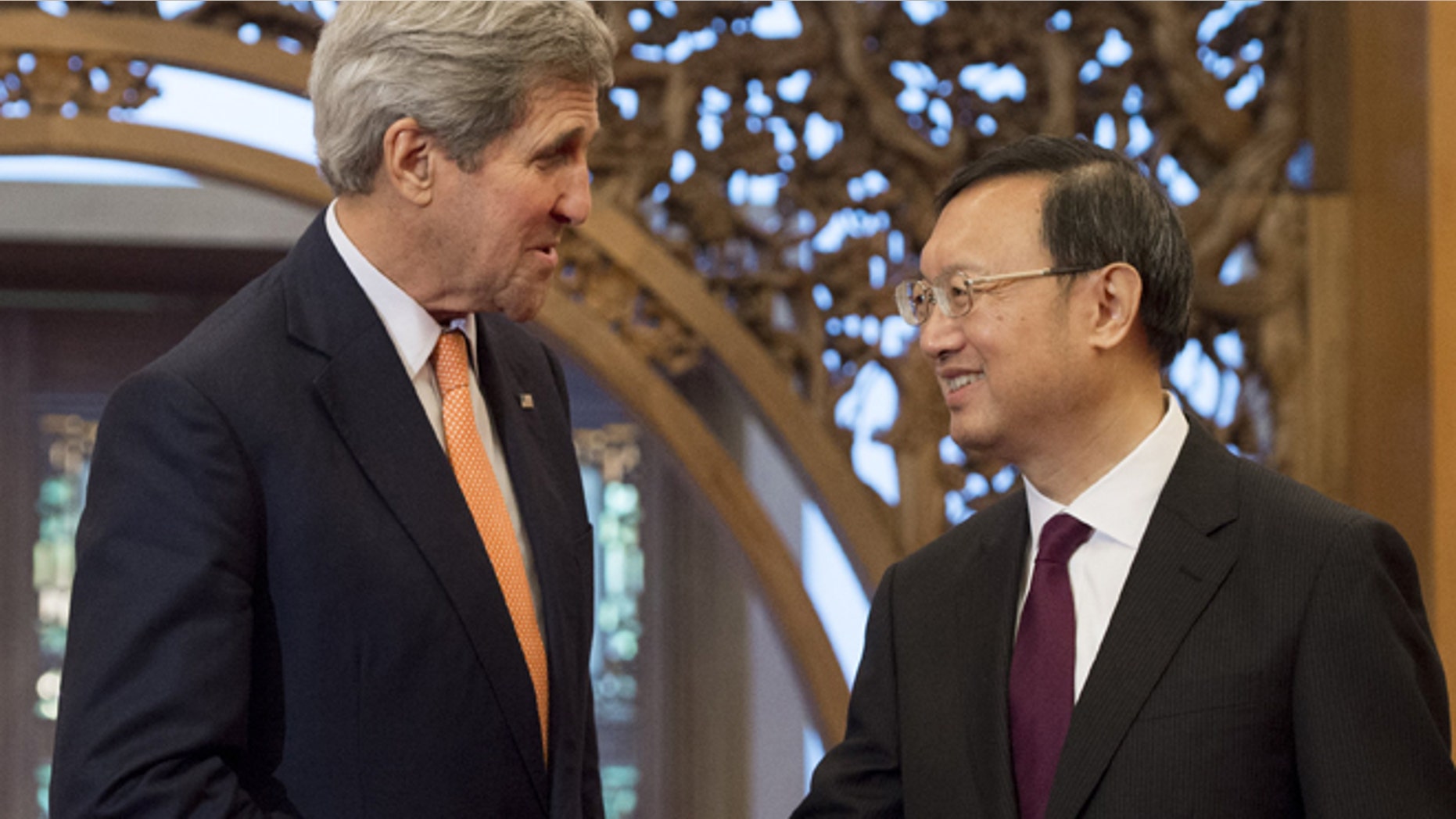 May 16, 2015: U.S. Secretary of State John Kerry, left, shakes hands with Chinese State Councilor Yang Jiechi at Diaoyutai State Guesthouse in Beijing. (AP)