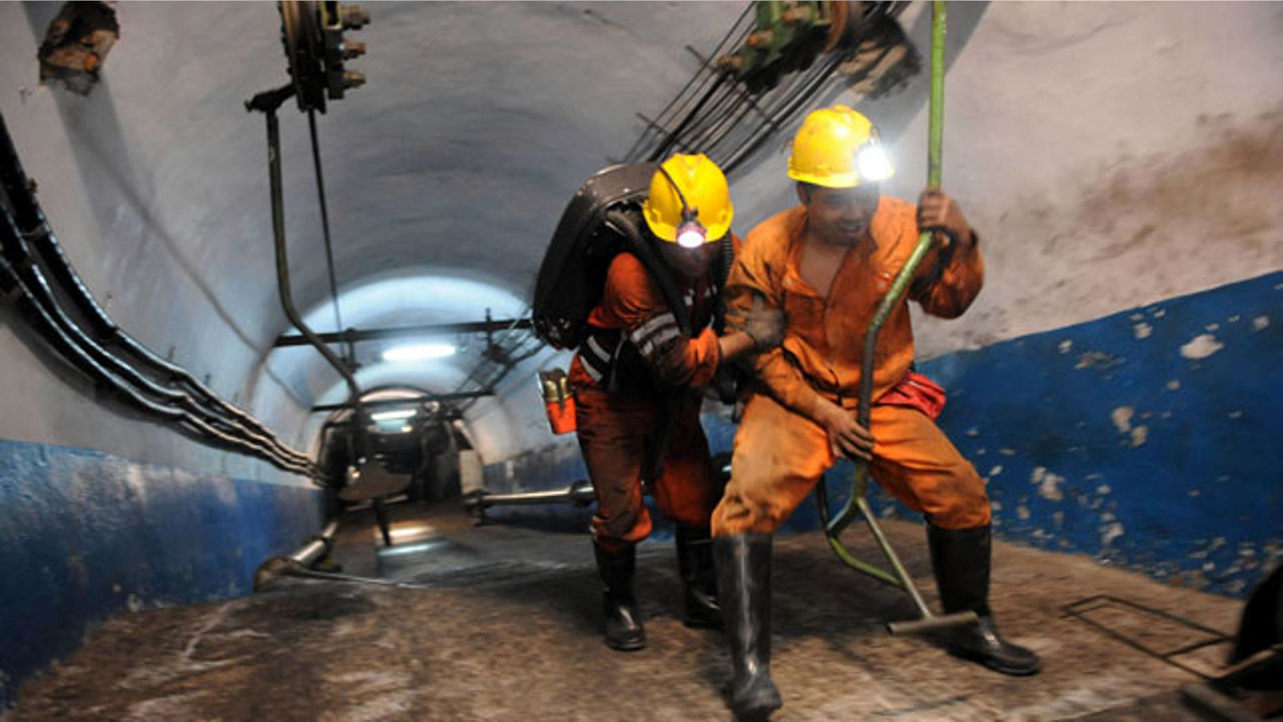 escuers are ready to go underground after an explosion at the state-run Pingyu Coal & Electric Co. Ltd mine in Yuzhou city, central China's Henan province, on Saturday Oct. 16, 2010. Rescuers battled dangerous levels of gas and the risk of falling coal as they worked to free 17 miners after the explosion at the coal mine in central China early Saturday.