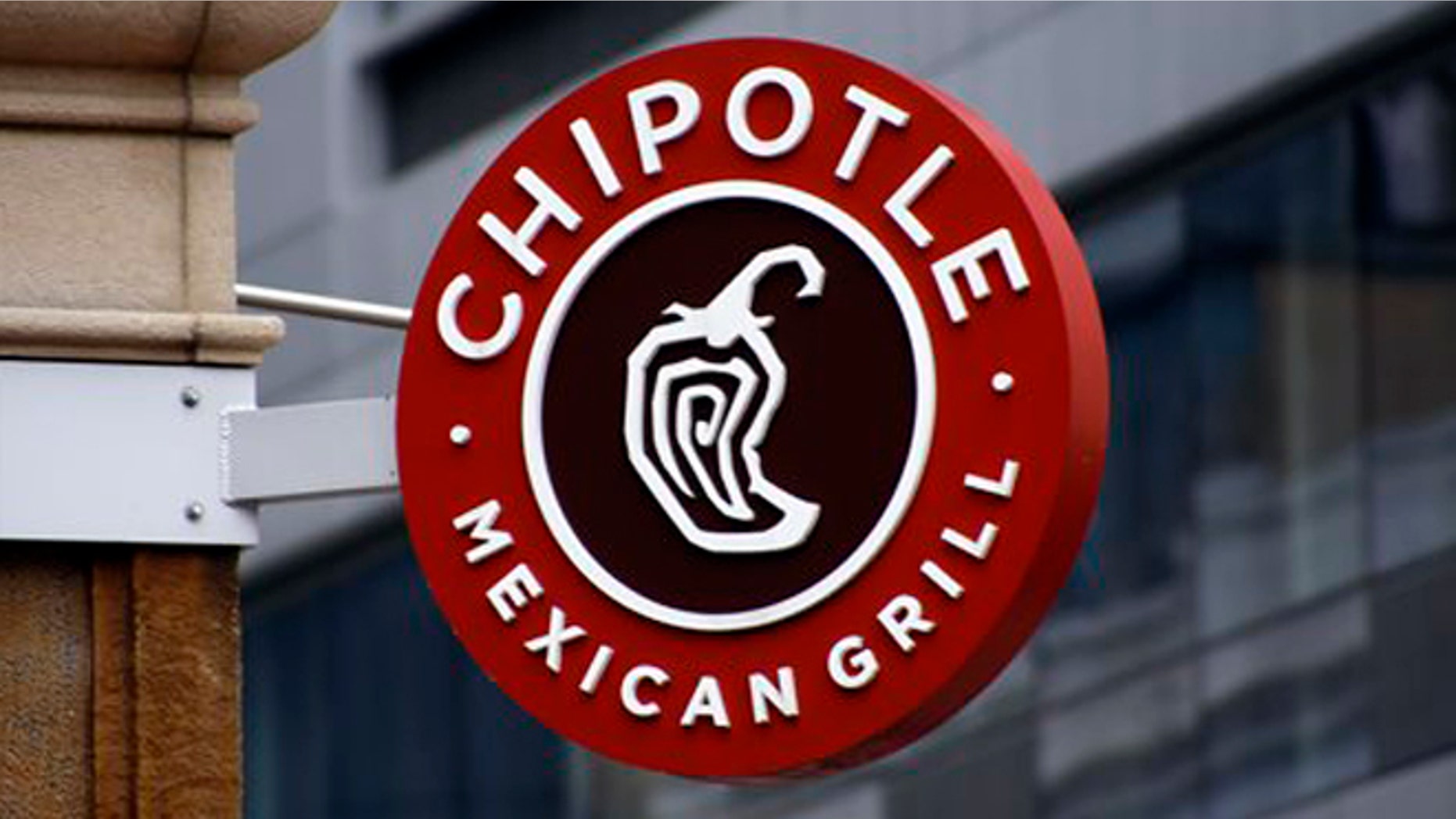 This Monday, Feb. 8, 2016, photo shows a sign for the Chipotle restaurant in Pittsburgh's Market Square. Chipotle is introducing a temporary loyalty program intended to get customers back into its stores following a series of food scares. On Monday, June 27, Chipotle said its "Chiptopia" loyalty program will reward people based on the number of times they visit each month, starting in July and running through September. The program has three reward levels, with more visits translating to more free entrees and other benefits. (AP Photo/Keith Srakocic)
