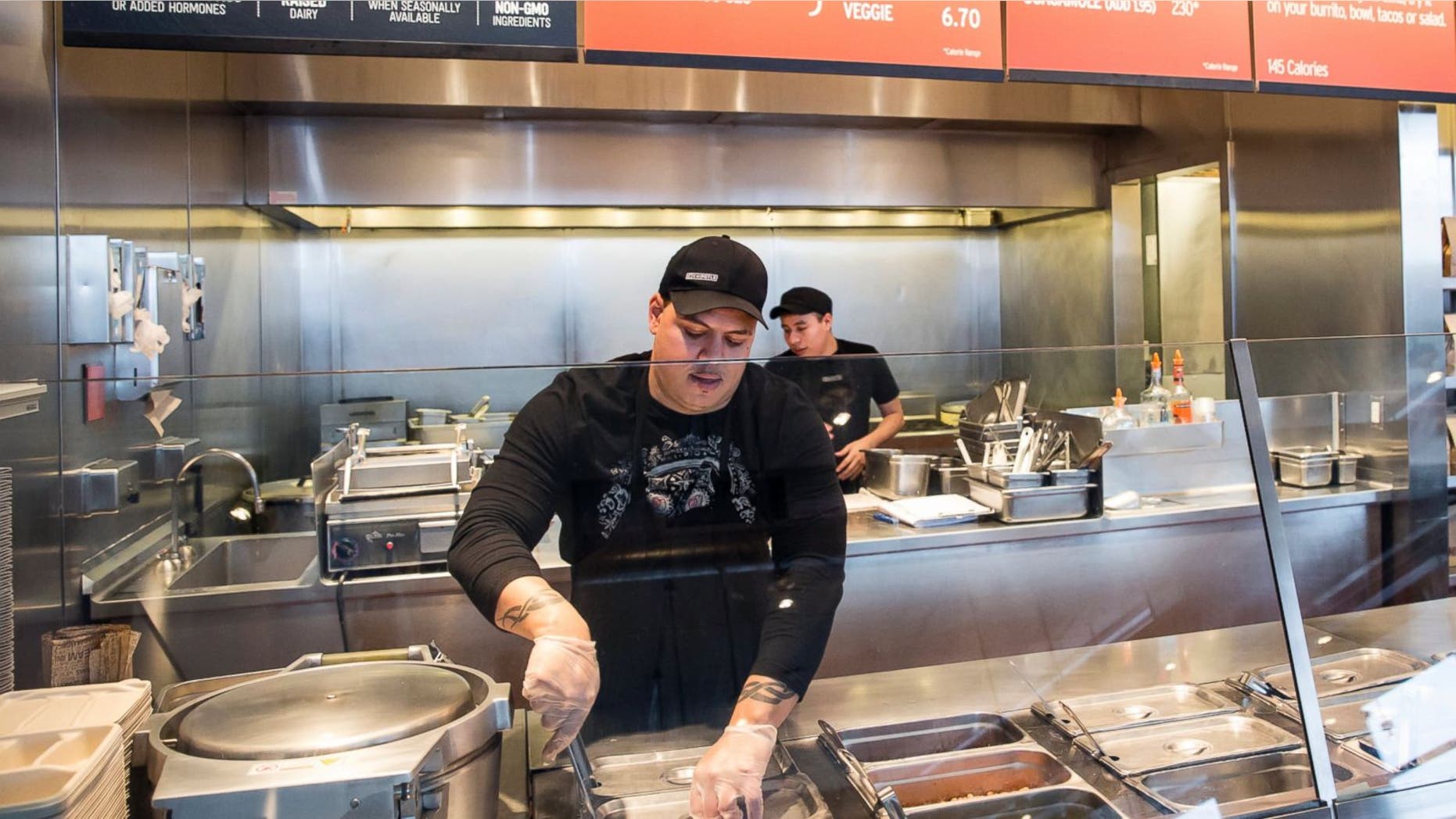A Chipotle Mexican Grill employee prepares food in a Seattle location.