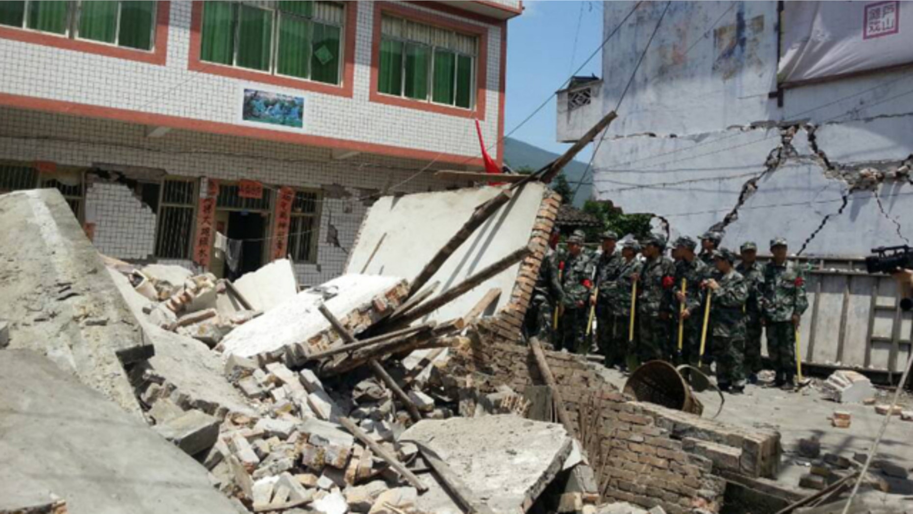 April 20, 2013: In this photo released by China's Xinhua news agency, buildings are destroyed by a powerful earthquake at Gucheng village of Longmen Township of Lushan County in Ya'an City, southwest China's Sichuan Province.