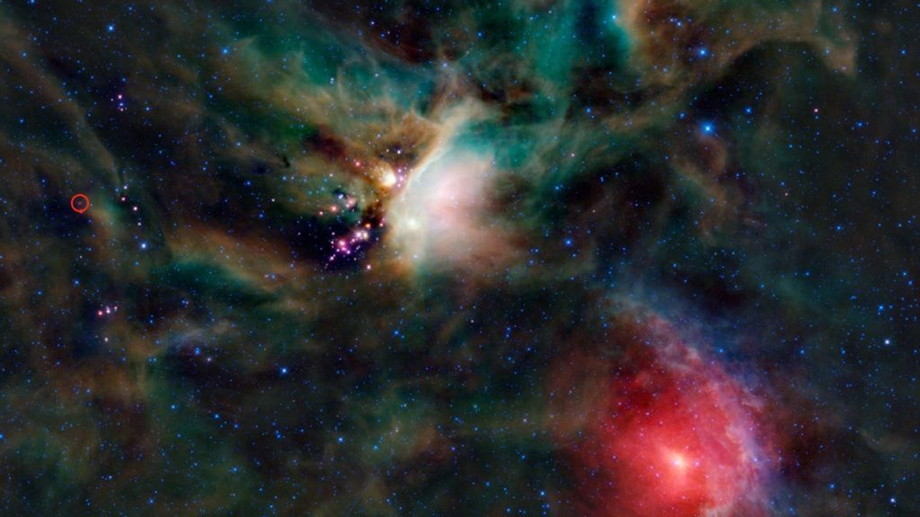 Organic compounds were identified in the protostar system IRAS 16293-2422. The young binary system sits in the Rho Ophiuchi cloud in the red circle on the left edge of this image.
