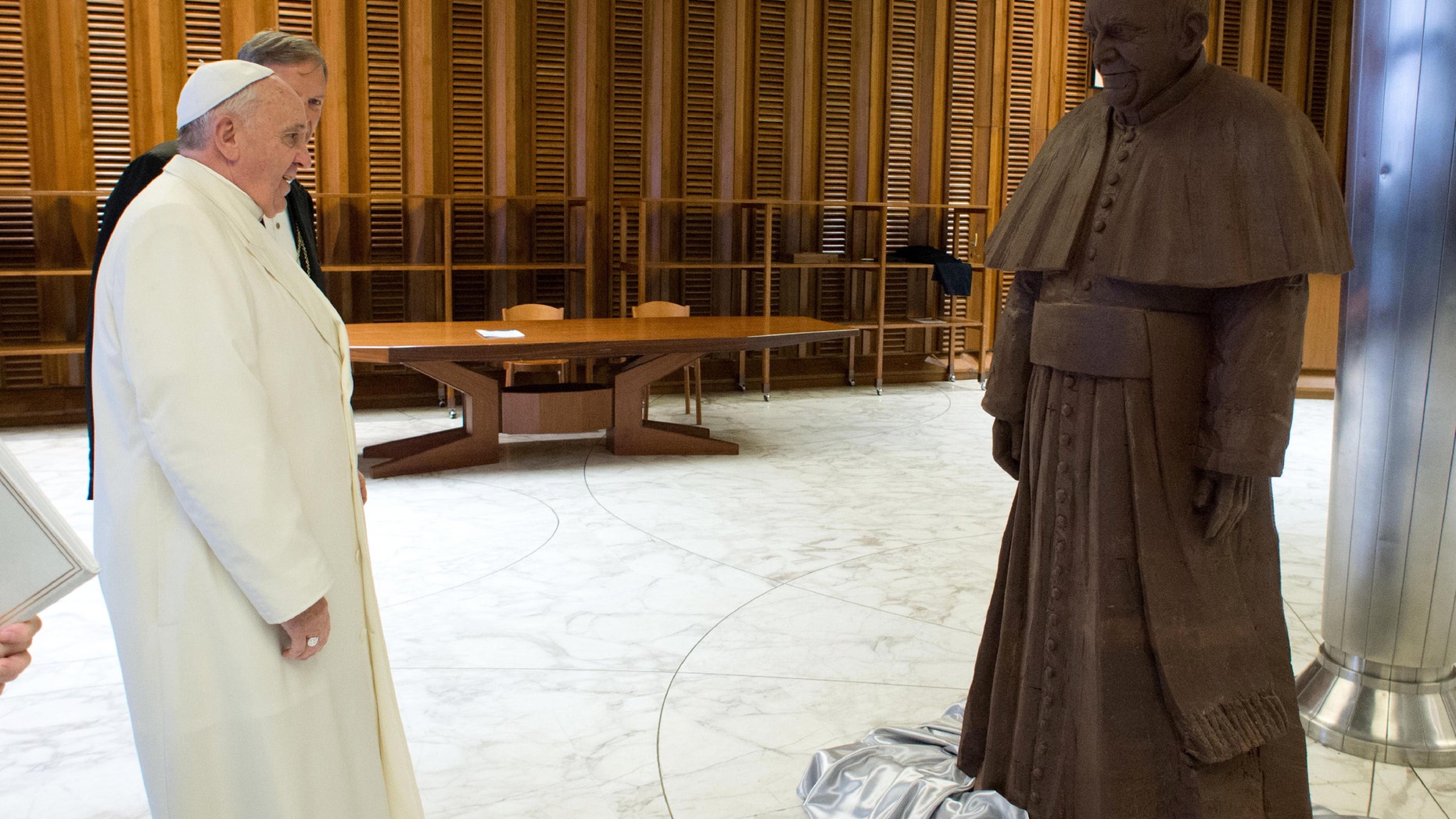 Feb. 6, 2014 - Pope Francis stands in front of a lifesize statue of chocolate of himself. The statue, made with 1.5 tons of cocoa, was presented to the Pope during the general audience of Feb. 5.