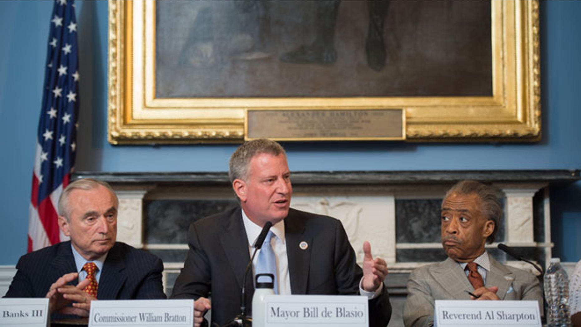 July 31, 2014: New York Mayor Bill de Blasio, center, is seated between New York City Police Commissioner William Bratton, left, and the Rev. Al Sharpton, during a roundtable discussion convened to ease tensions over the July 17 police-involved death of Eric Garner.