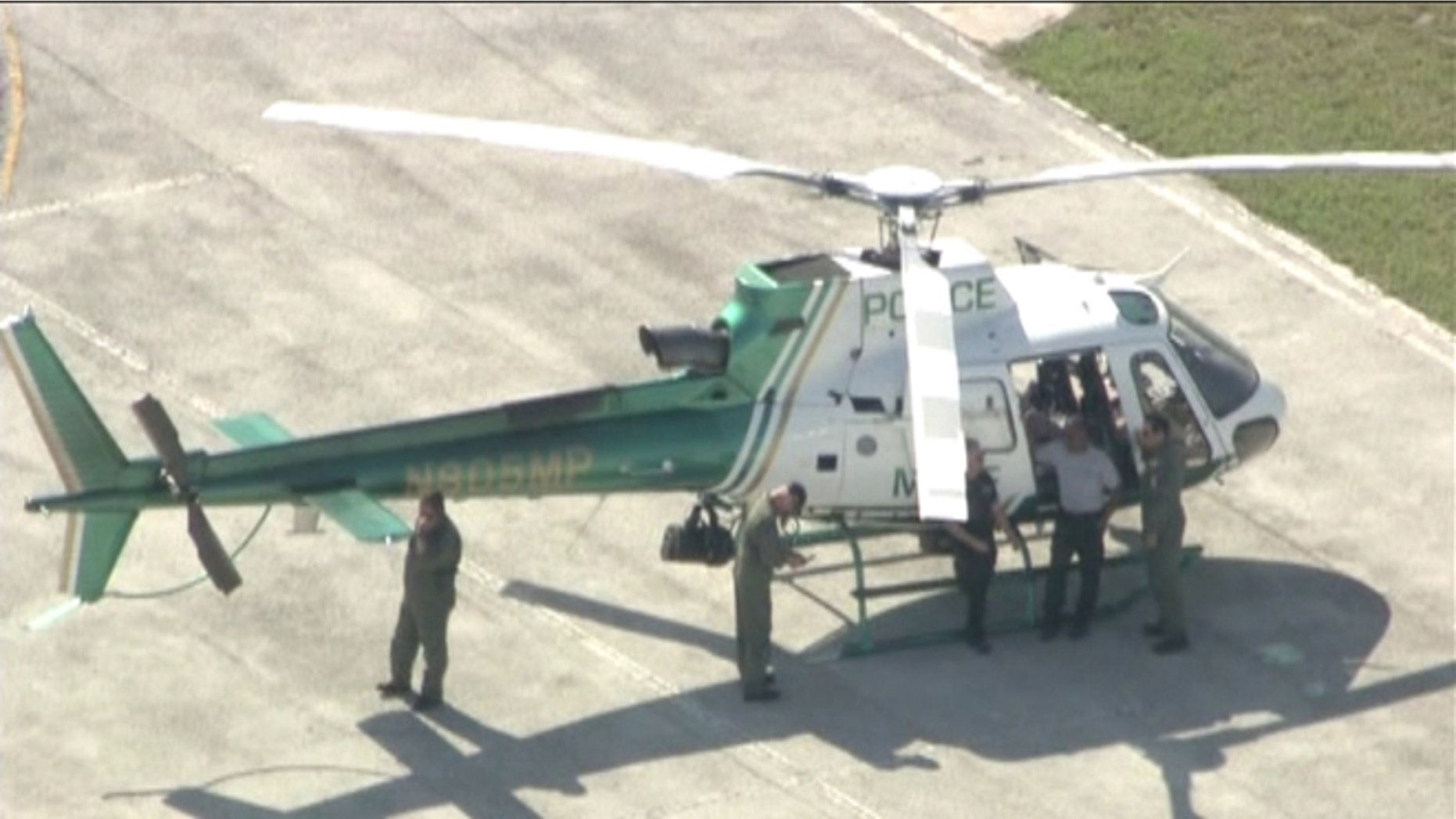 A Miami-Dade police helicopter, above, was forced to make an emergency landing after colliding with a large bird.