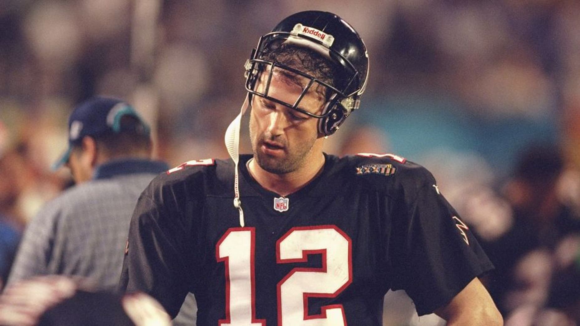 31 Jan 1999: Quarterback Chris Chandler #12 of the Atlanta Falcons catches his breath during Superbowl XXXIII against the Denver Broncos at the Pro Player Stadium in Miami, Florida. The Broncos defeated the Falcons 34-19. Mandatory Credit: Andy Lyons/Allsport