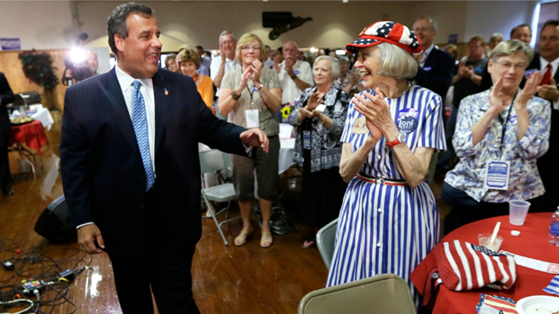 This July 17, 2014, file photo shows New Jersey Gov. Chris Christie greeting Iowans after speaking at a fundraiser for Iowa Gov. Terry Branstad in Davenport, Iowa.