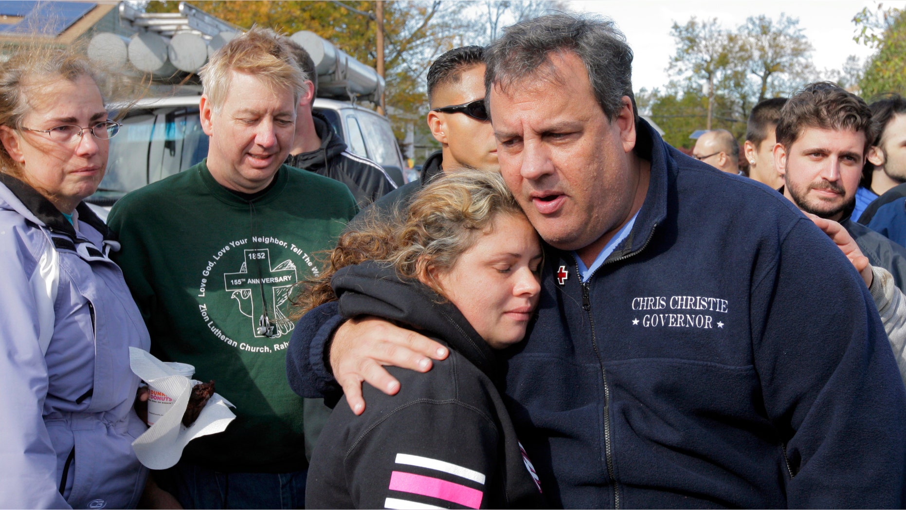 New Jersey Gov. Chris Christie comforts Kerri Berean, 33, a Chapman Street resident, in this Nov. 3, 2012 taken in Little Ferry, N.J.