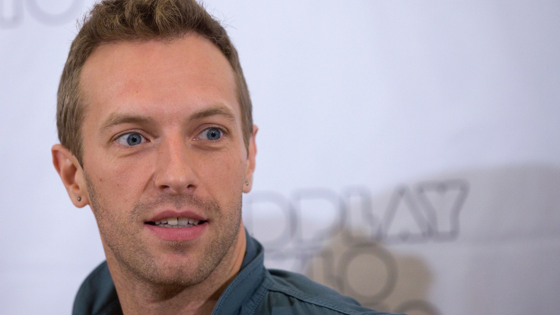 October 26, 2011. Coldplay lead vocalist Chris Martin reacts during a photocall for the presentation of their new album "Mylo Xyloto" in Madrid.