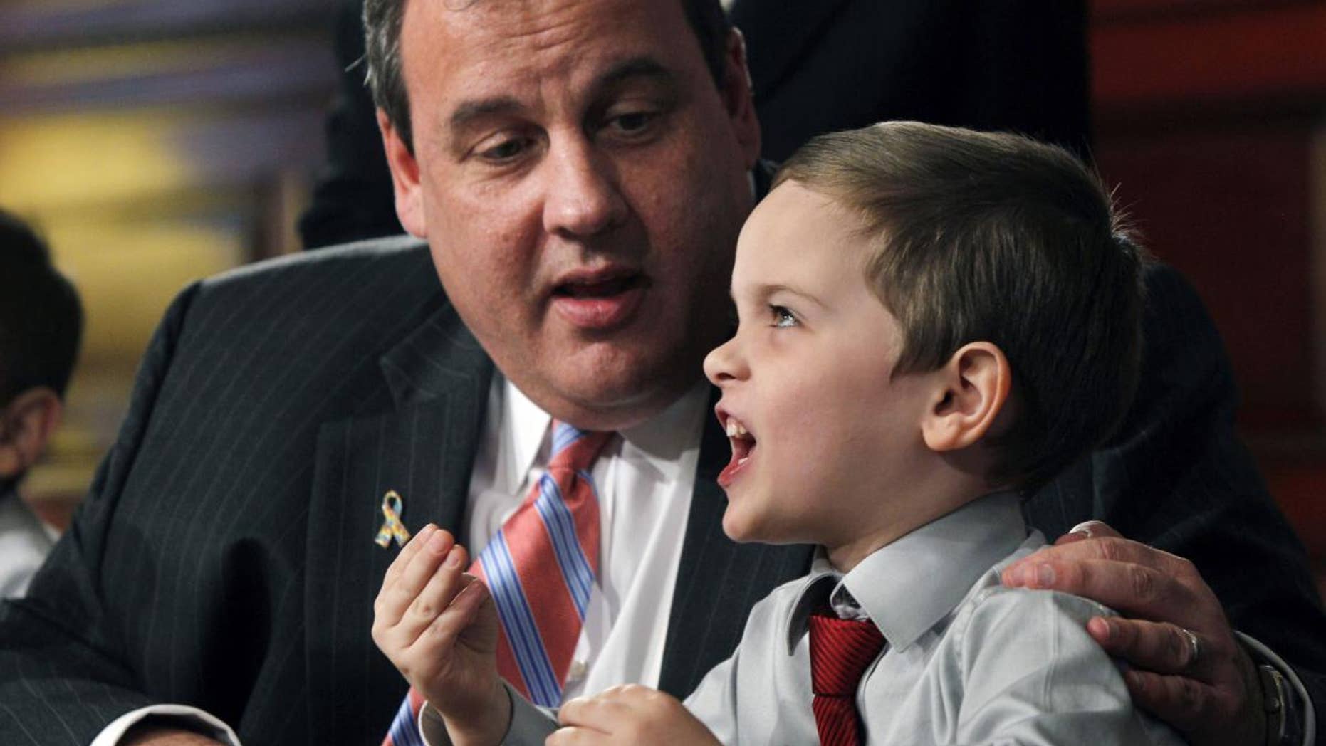 New Jersey Gov. Chris Christie listens Wednesday, April 6, 2011, in Trenton, N.J., to now 5-year-old Jesse Koczon after Christie signed a proclamation making Jesse the state's honorary governor for the day. (AP Photo/Mel Evans)