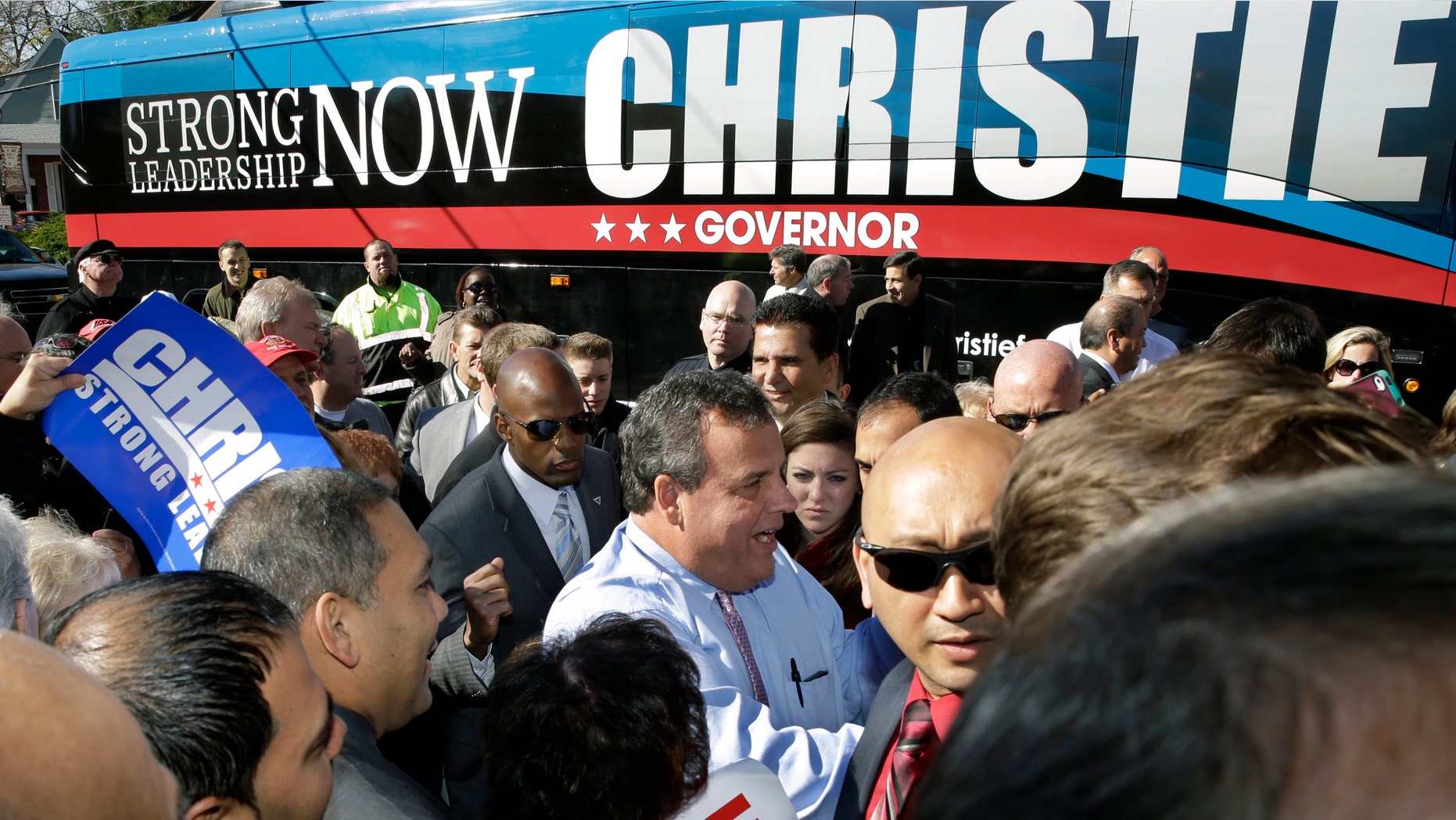New Jersey Gov. Chris Christie, center, greets supporters during a campaign stop in Hillside, N.J., Monday, Nov. 4, 2013. Christie will face Democratic candidate, Barbara Buono in an election Tuesday, Nov. 5, 2013.