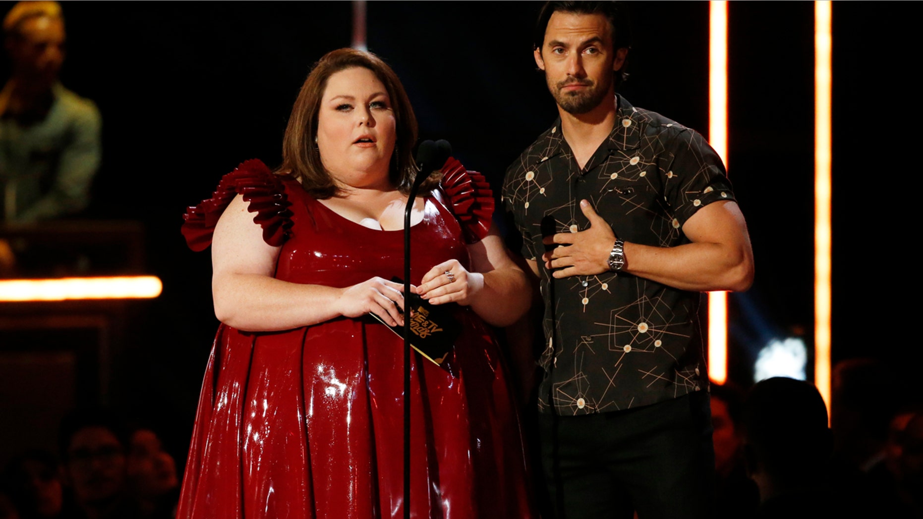 Chrissy Metz and Milo Ventimiglia present an award at the 2017 MTV Movie and TV Awards.