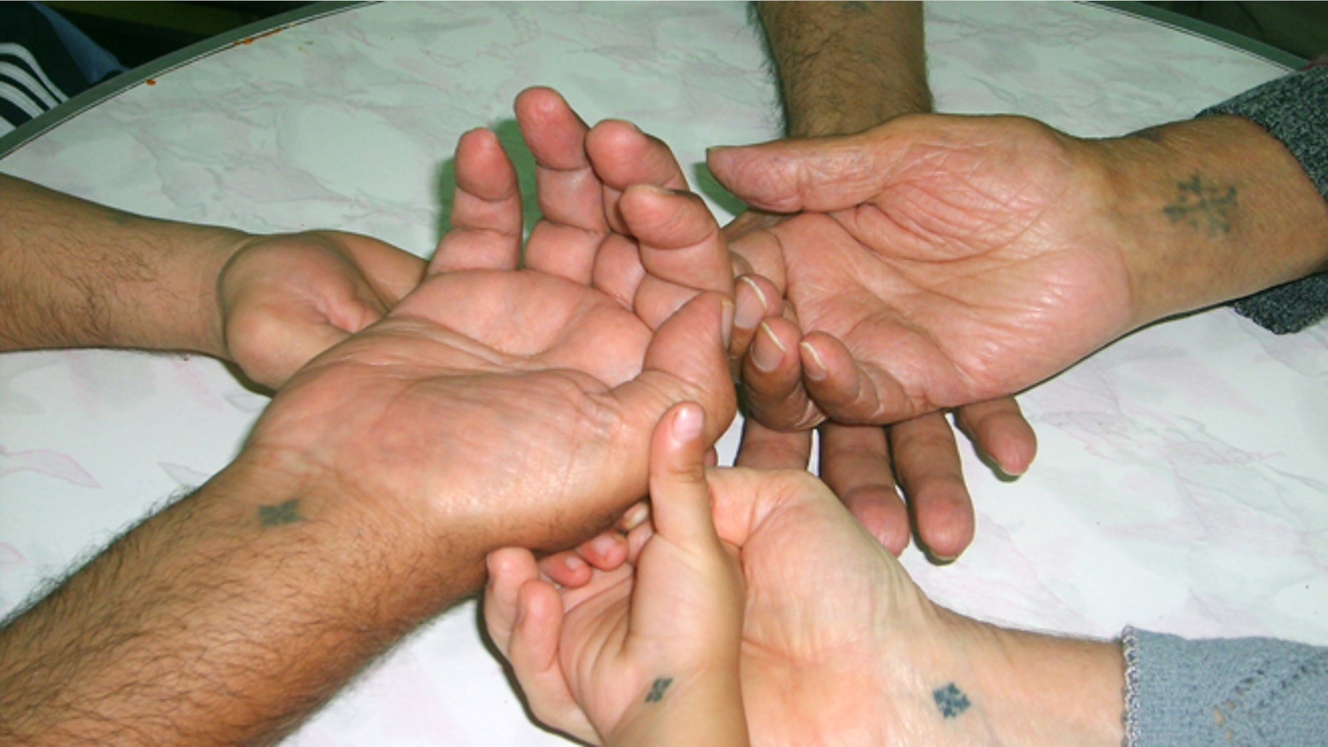 Coptic Christians identify themselves with tattoos of the Coptic cross (Aid to the Church in Need-US)