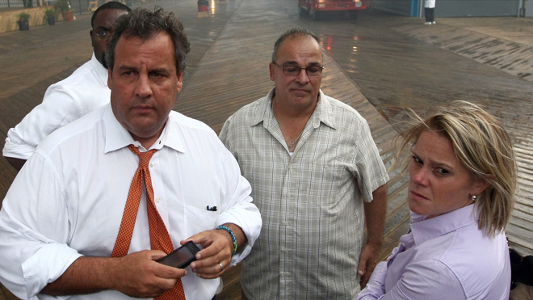 Sept. 12, 2013: Deputy Chief of Staff Bridget Anne Kelly, right, stands with Gov. Chris Christie, left, during a tour of the Seaside Heights, N.J. boardwalk after it was hit by a massive fire.