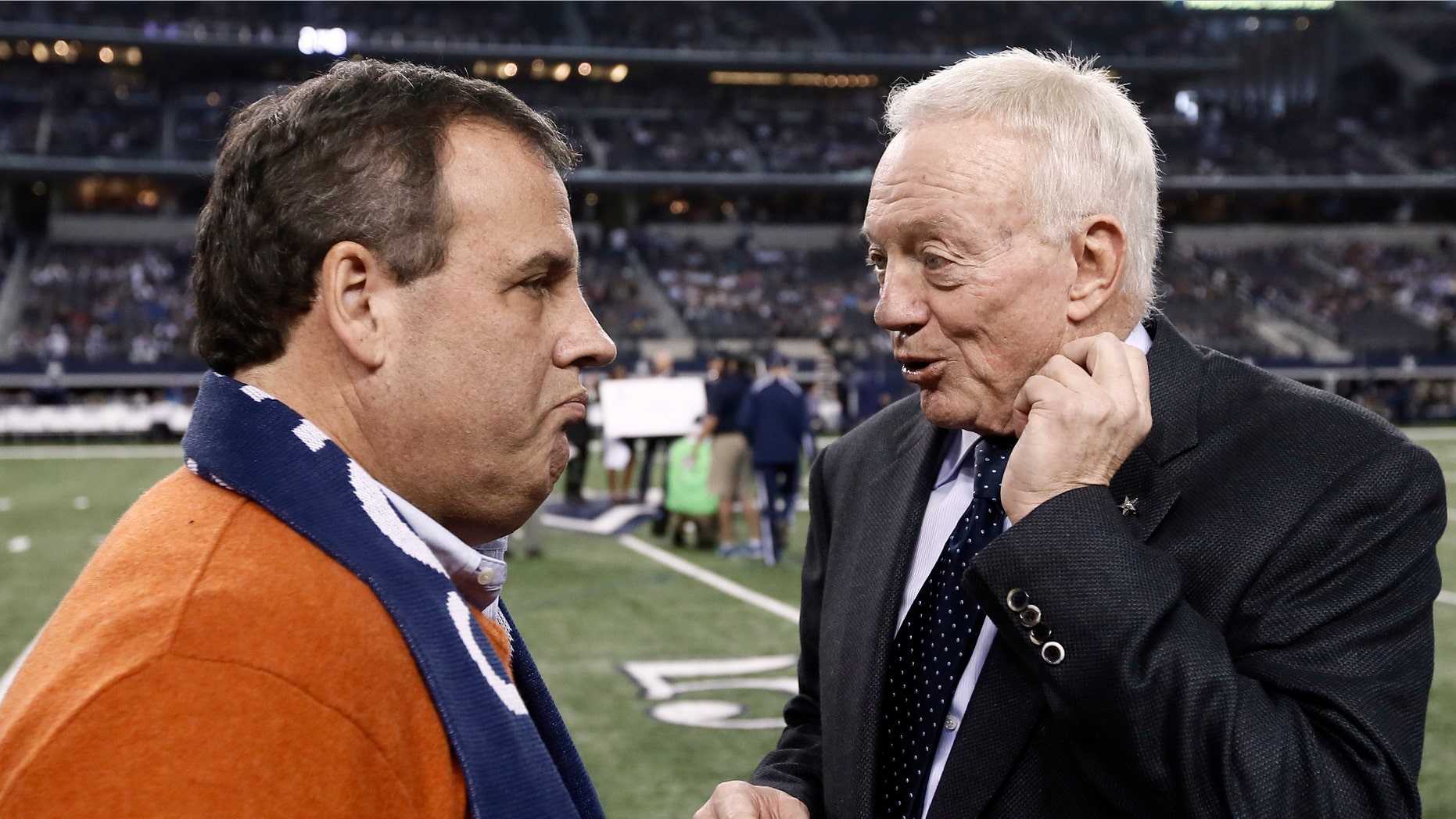Dec. 21, 2014: New Jersey Gov. Chris Christie, left, talks with Dallas Cowboys team owner Jerry Jones, right, on the field as the teams warm up before an NFL football game against the Indianapolis Colts