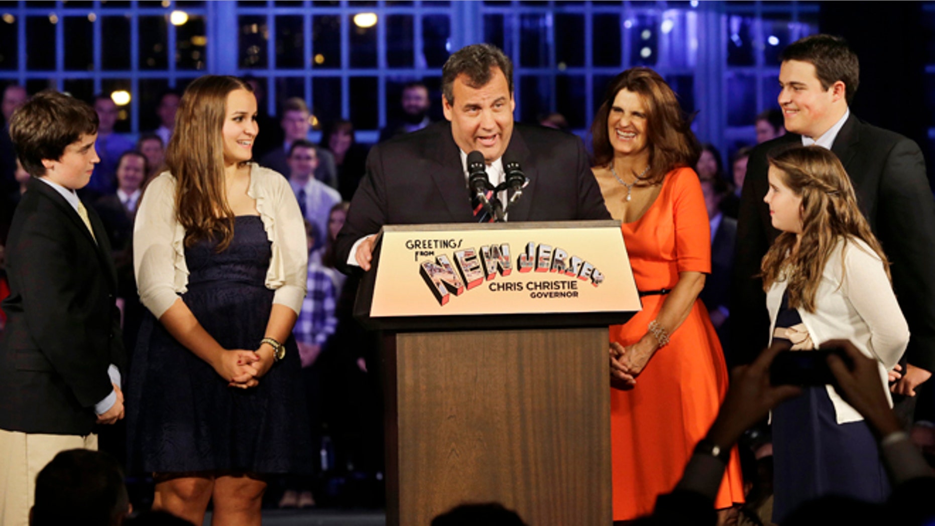 Nov. 5, 2013: New Jersey Gov. Chris Christie greets a gathering as he stands with his wife Mary Pat Christie, center right, and their children, Andrew, back right, Bridget, front right, Patrick, left, and Sarah, second left, in Asbury Park, N.J.