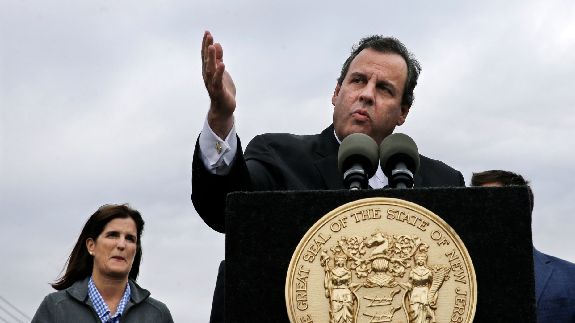 Oct. 29, 2014: As wife Mary Pat Christie, left, looks on, New Jersey Gov. Chris Christie tells heckler Jim Keady to: "Sit down and shut up," during a event marking the second anniversasry of Superstorm Sandy