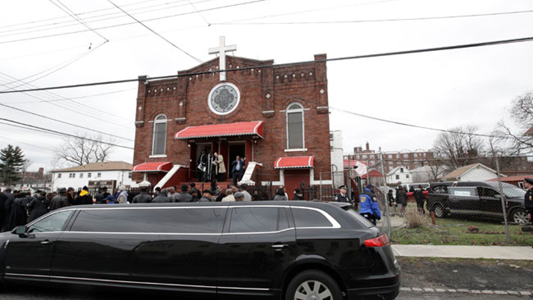 People attend the funeral services for Timothy Caughman Saturday, April 1, 2017, in New York. Caughman was alone and collecting bottles for recycling last month when he was attacked from behind with a sword. Authorities say his assailant, James Harris Jackson, took a bus last month to New York to target black men. Jackson is being held without bail on charges of murder as a hate crime. (AP Photo/Frank Franklin II)