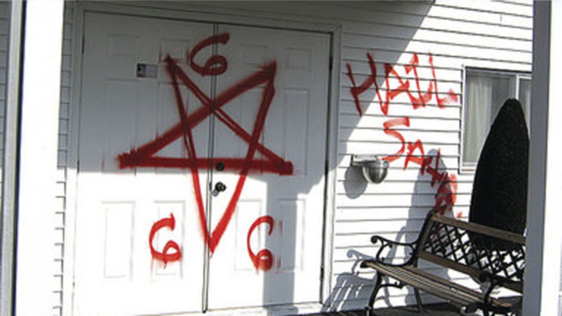 Bright red spray-paint was used to write "Hail Satan" and "666"outside walls of Gospel Light Missionary Baptist Church.