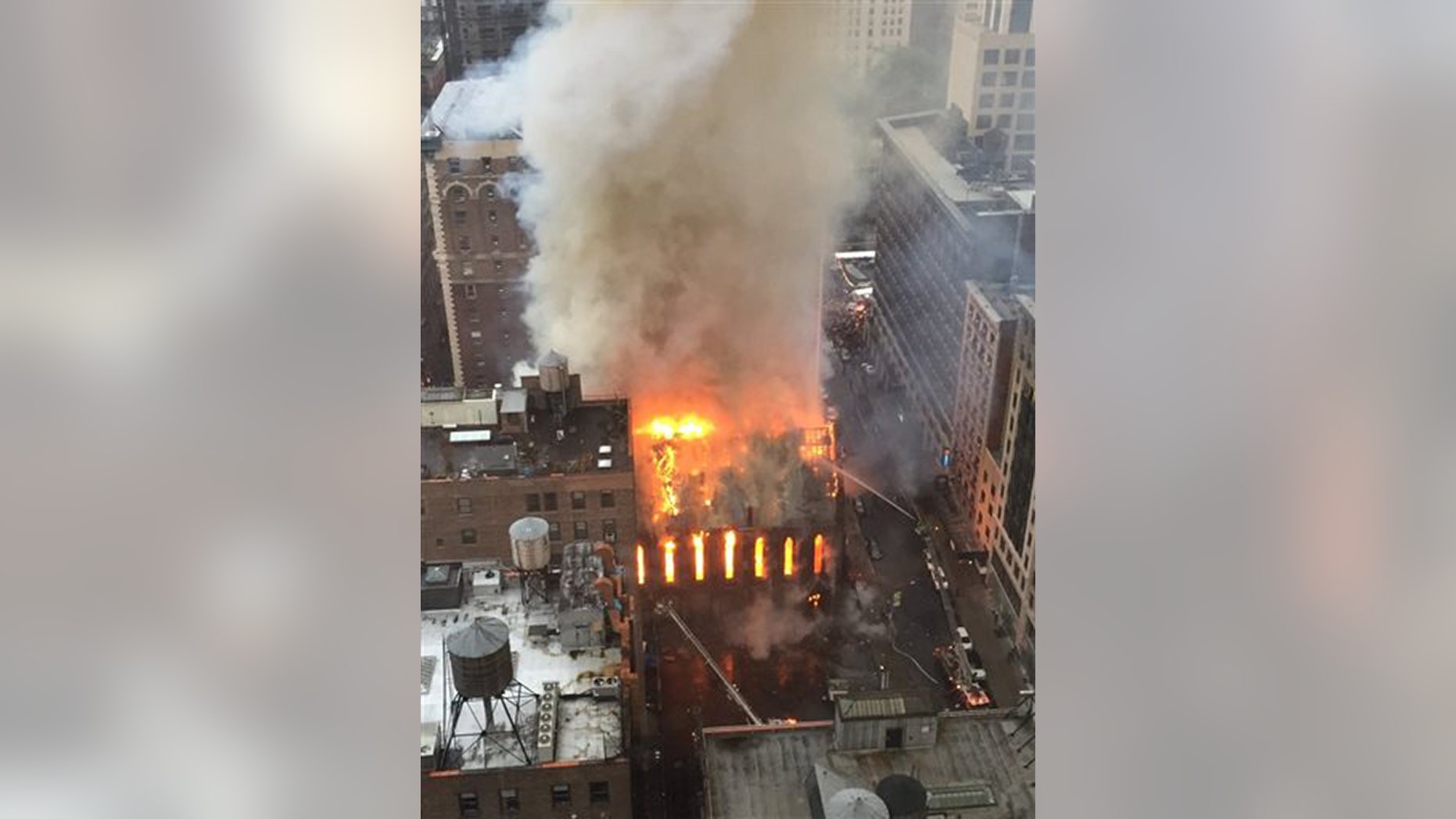 Firefighters battle flames at an historic Serbian Orthodox Cathedral of St. Sava in New York, Sunday, May 1, 2016. The church was constructed in the early 1850s and was designated a New York City landmark in 1968. (Anindya Ghose via AP) MANDATORY CREDIT