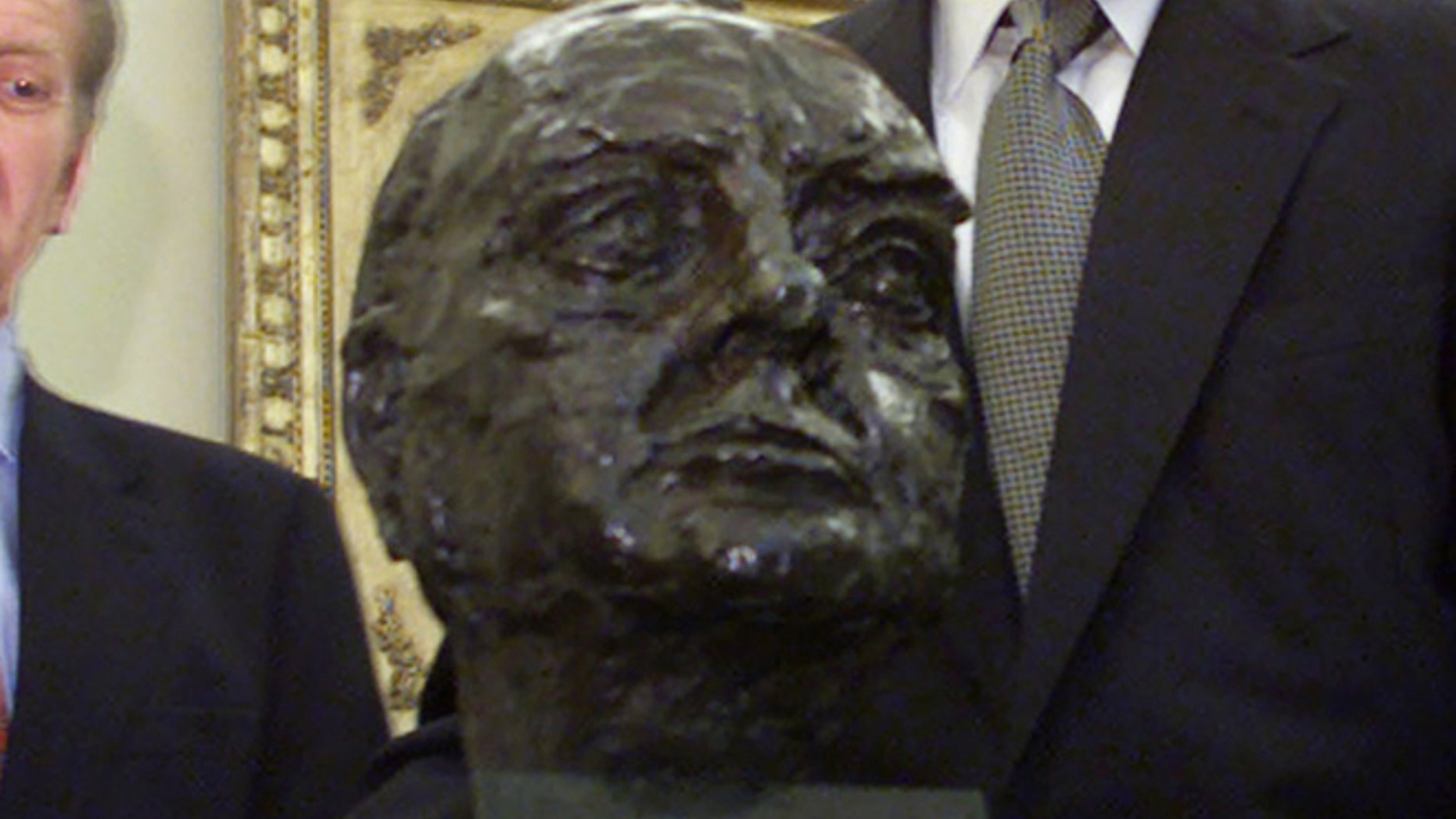 FILE: In this July 16, 2001 photo, a bust of Winston Churchill is seen in the Oval Office of the White House.
