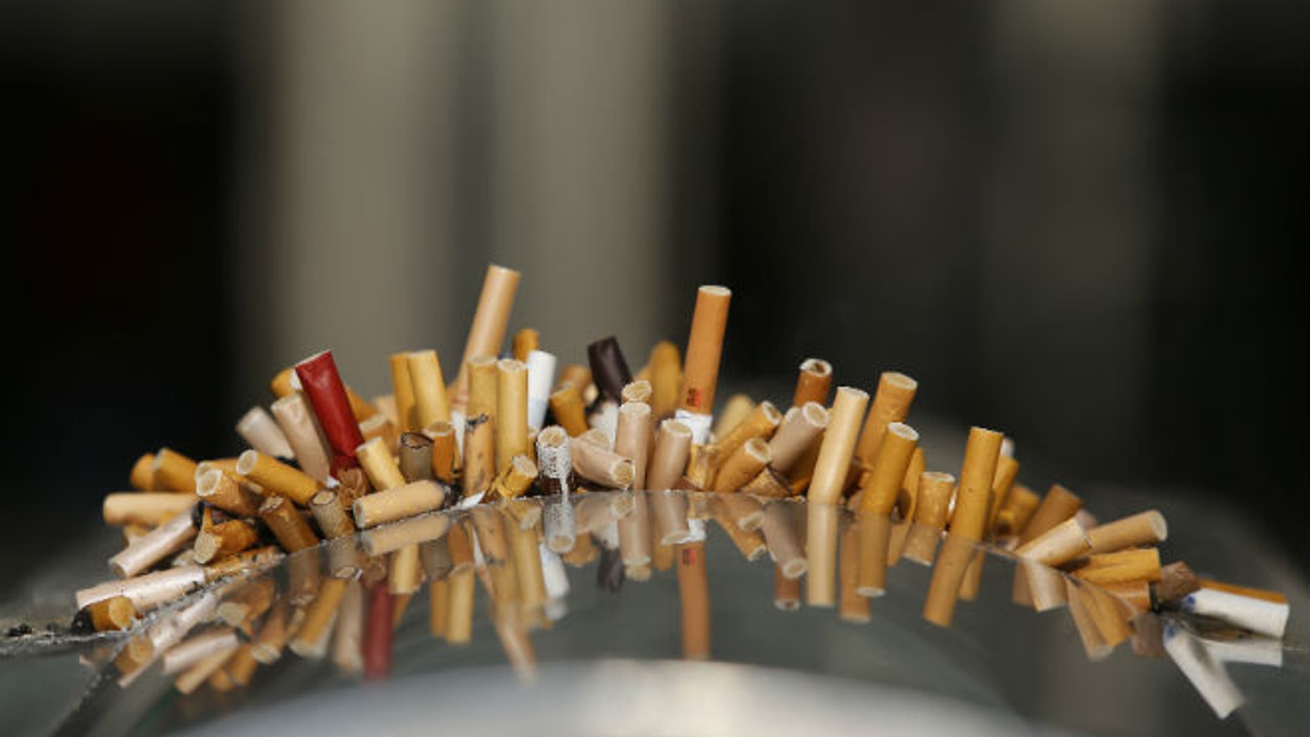 Extinguished cigarettes are seen in an ashtray at the Shanghai Railway Station (REUTERS/Aly Song)