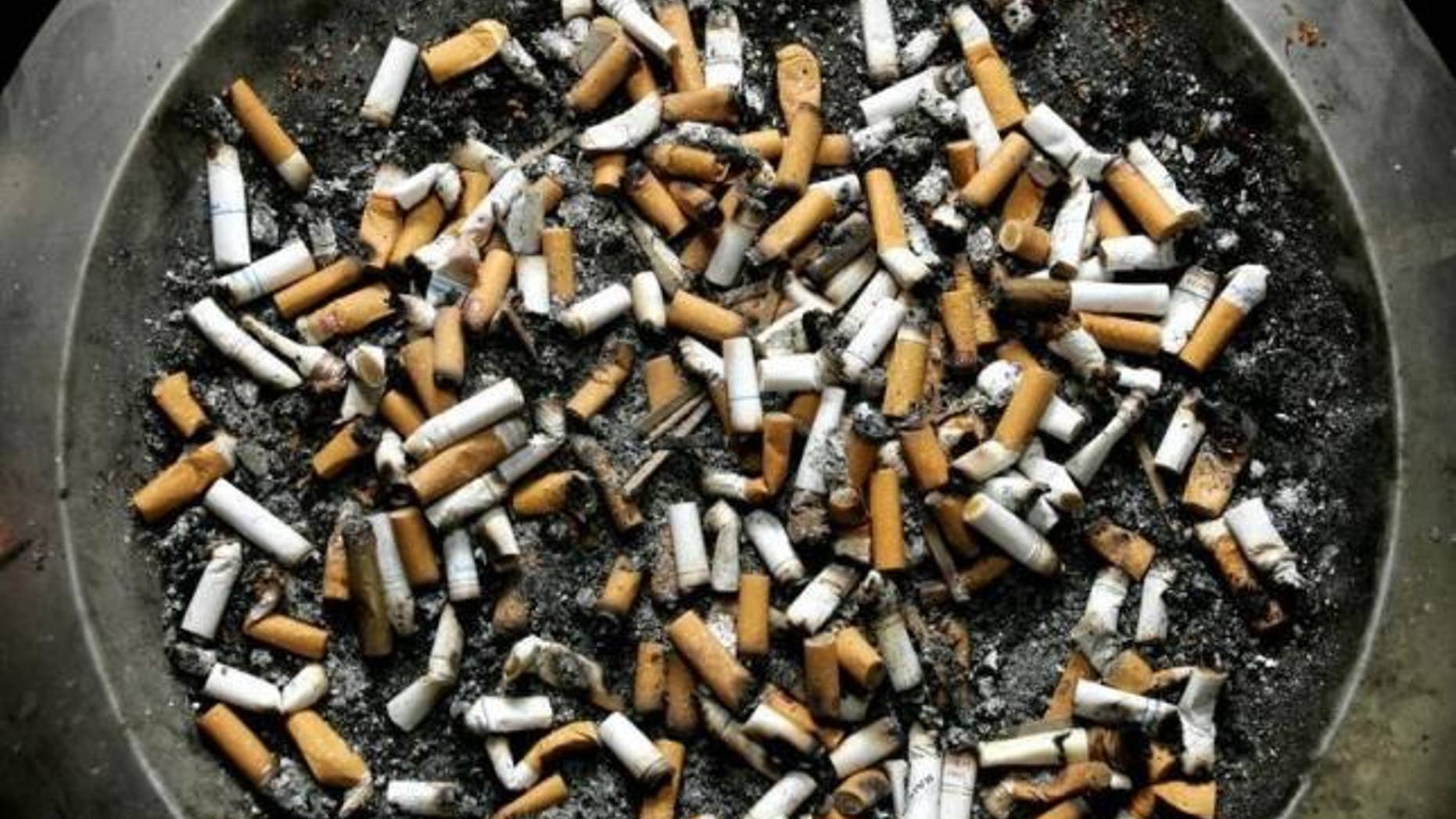Feb. 21, 2005: Cigarette butts lie in an ashtray outside a Montreal office building.