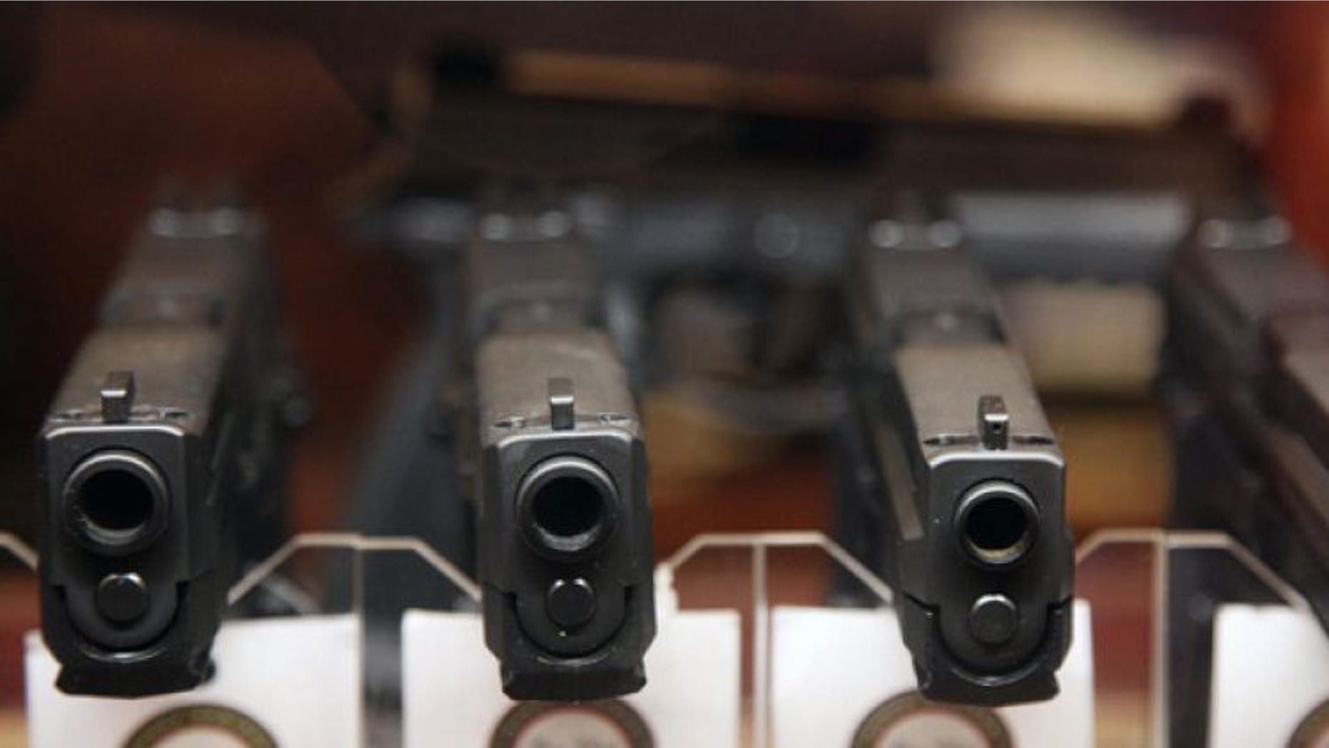 Jan. 4, 2013: Handguns are displayed in the sales area of Sandy Springs Gun Club and Range, in Sandy Springs, Ga.