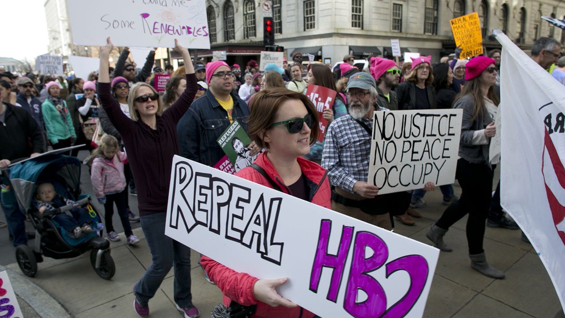 Protesters march up Fayetteville Street during the annual “Historic Thousands on Jones Street" (HKonJ) march in Raleigh, N.C., on Saturday, Feb. 11, 2017.