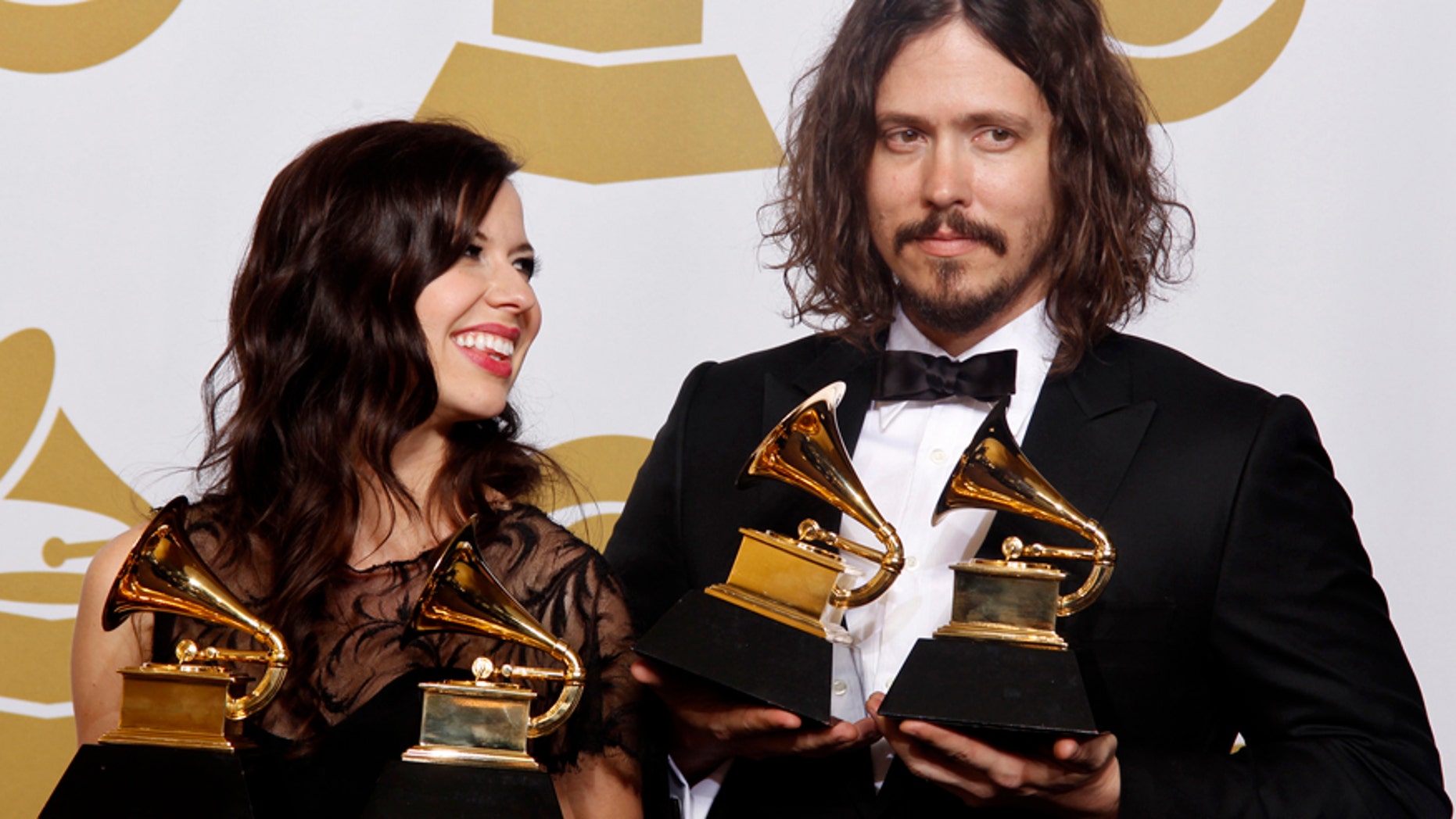 Joy Williams and John Paul White of The Civil Wars hold their awards for "Best Country Due/Group Performance and Best Folk Album" (Barton Hollow) at the 54th annual Grammy Awards in Los Angeles, California, February 12, 2012.