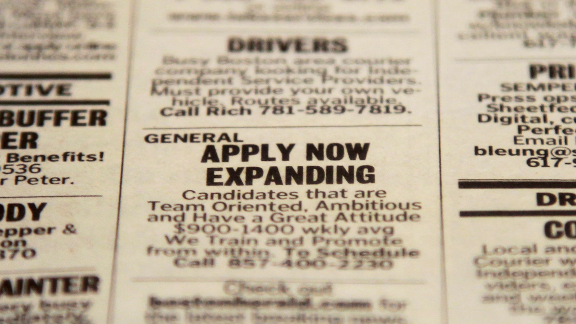 FILE - In this Tuesday, Dec. 11, 2012 file photo, an advertisement in the classified section of the Boston Herald newspaper calls attention to possible employment opportunities in Walpole, Mass. U.S. employers added 155,000 jobs in December, a steady gain that shows hiring held up during the tense negotiations to resolve the fiscal cliff. The solid job growth wasnât enough to push down the unemployment rate, which remained 7.8 percent last month, the Labor Department said Friday, Jan. 4, 2013. The rate for November was revised up from an initially reported 7.7 percent. (AP Photo/Steven Senne, File)