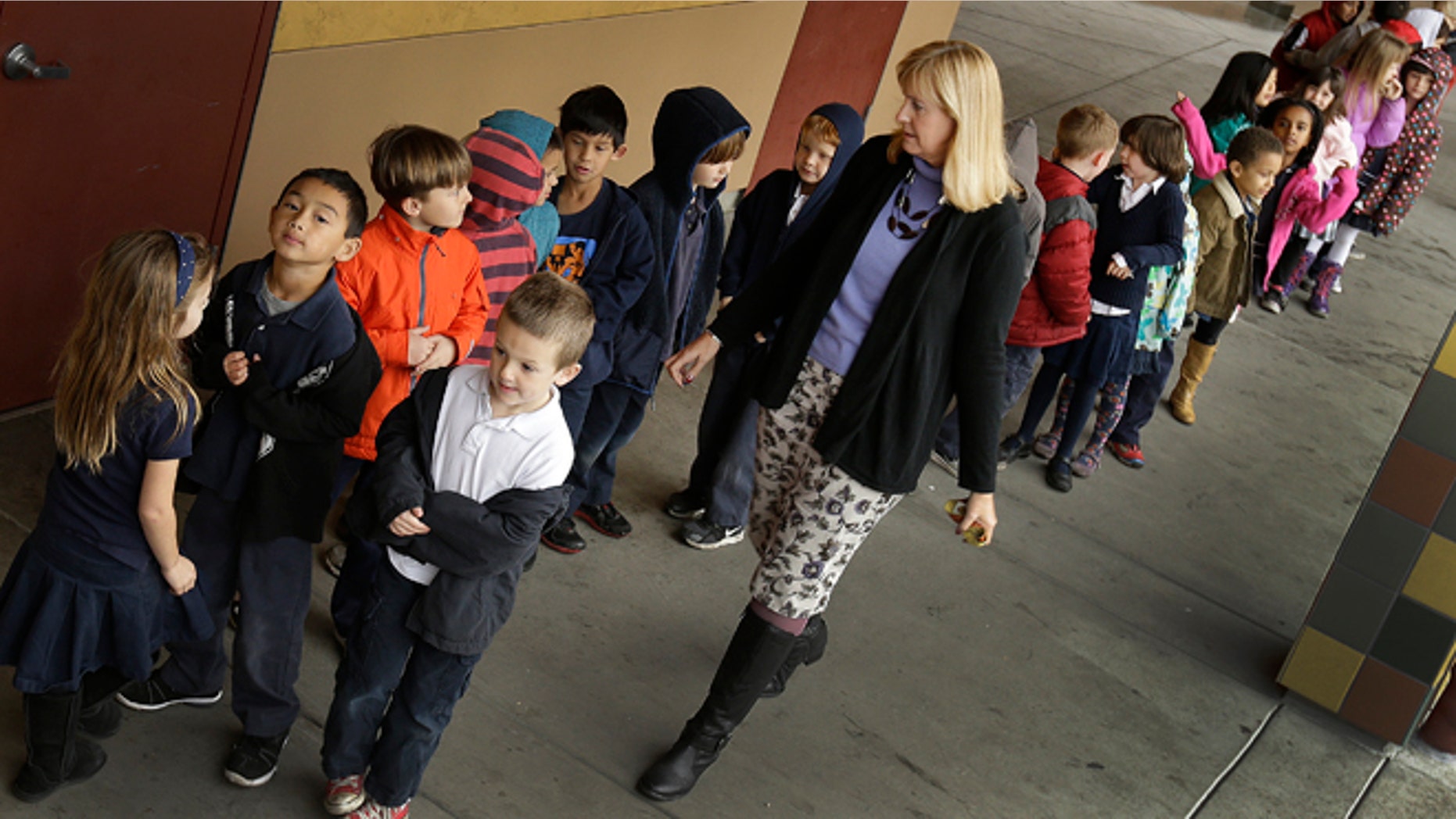 Jan. 24, 2013: First grade teacher Lynda Jensen walks her class of 30 children at the Willow Glenn Elementary School in San Jose, Calif.