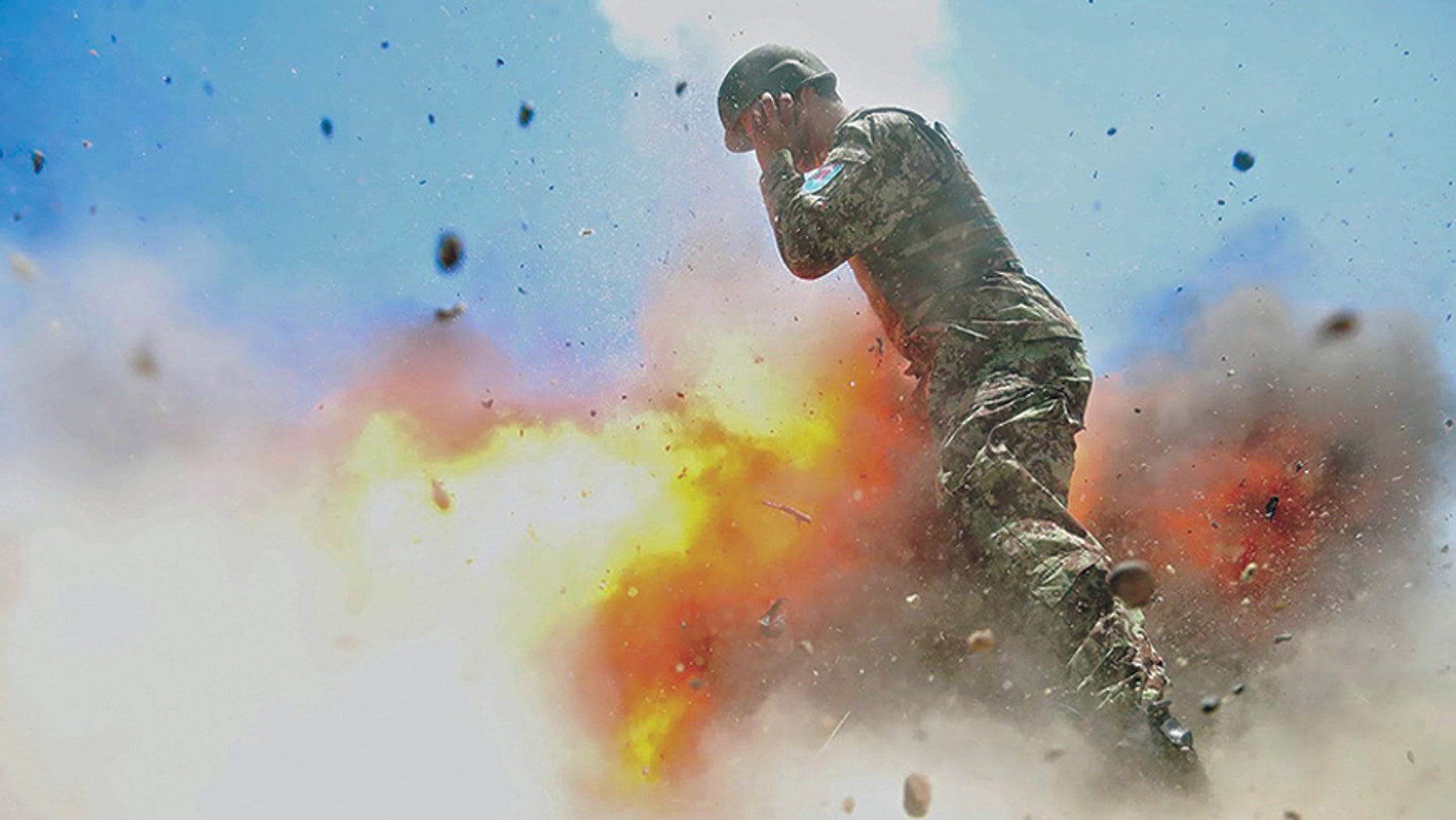 A mortar tube accidentally explodes during an Afghan National Army live-fire training exercise in Laghman province, Afghanistan, July 2, 2013. This photo was taken by U.S. Army Spc. Hilda Clayton, who died in the blast.