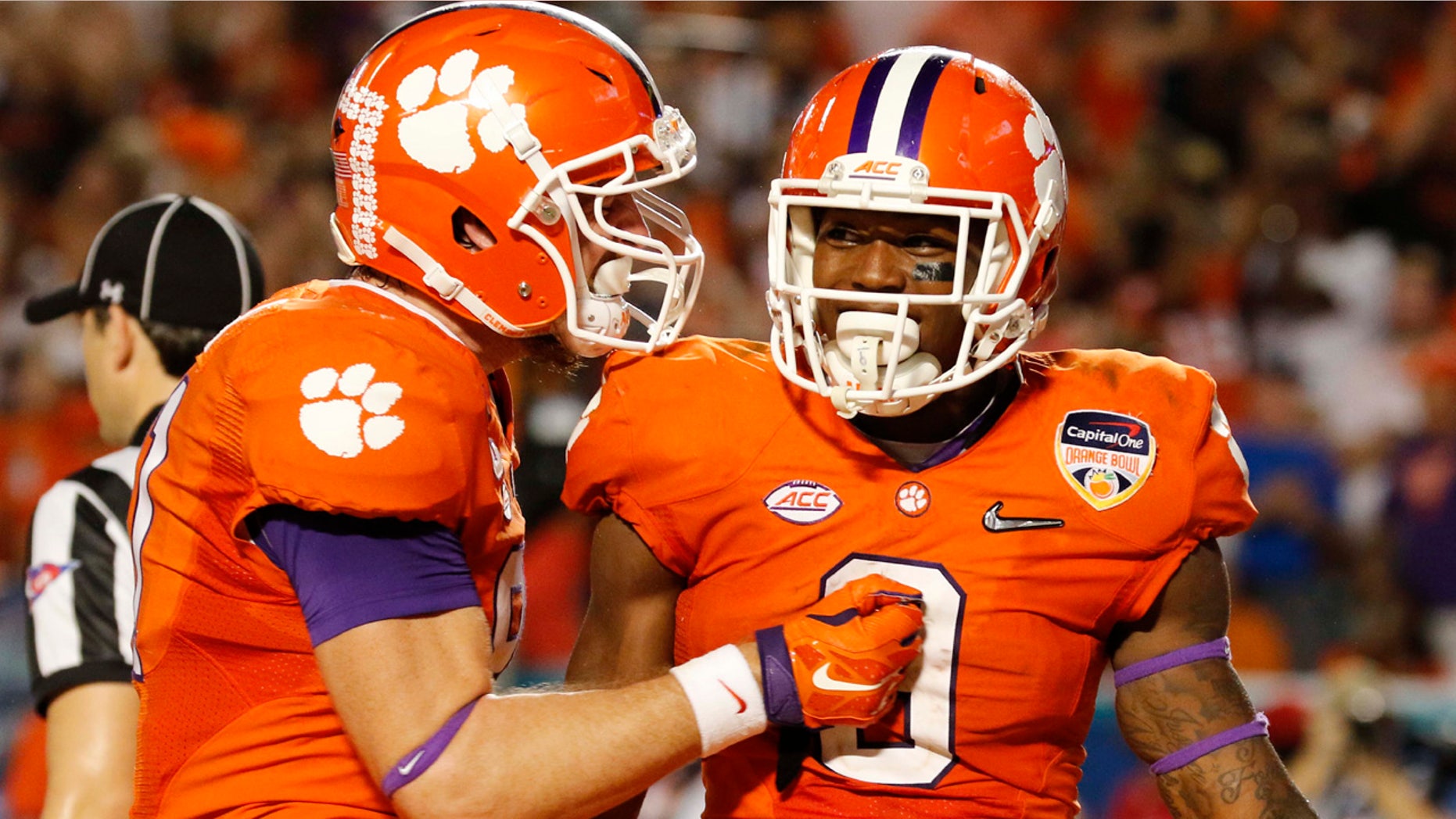 Dec. 31, 2015: Clemson running back Wayne Gallman (9) is congratulated by tight end Stanton Seckinger (81) during the second half of the Orange Bowl NCAA college football semifinal playoff game against Oklahoma in Miami Gardens, Fla. (AP Photo/Joe Skipper)