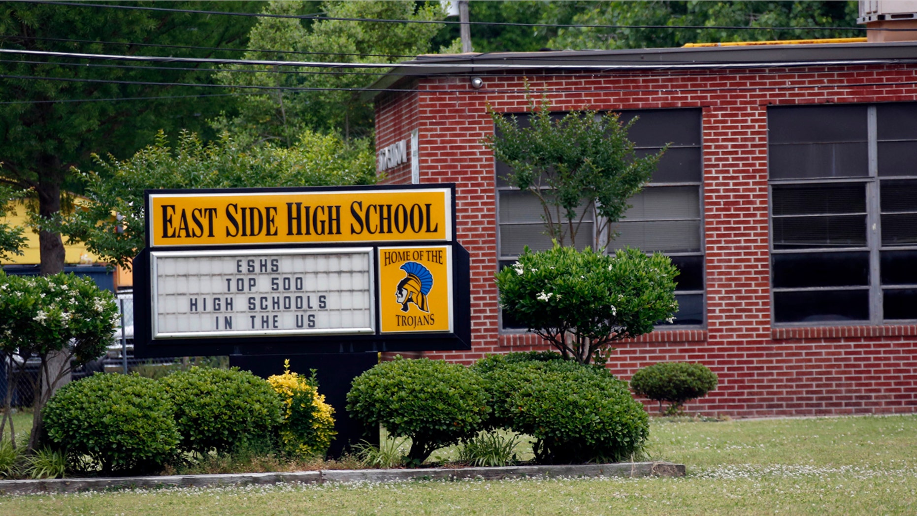 May 13, 2015: This photo shows the landscaped front of East Side High School in Cleveland, Miss.. The school could possibly undergo a name and mission change after a federal judge ruled Friday that the school district must merge its high schools and middle schools to achieve racial desegregation.