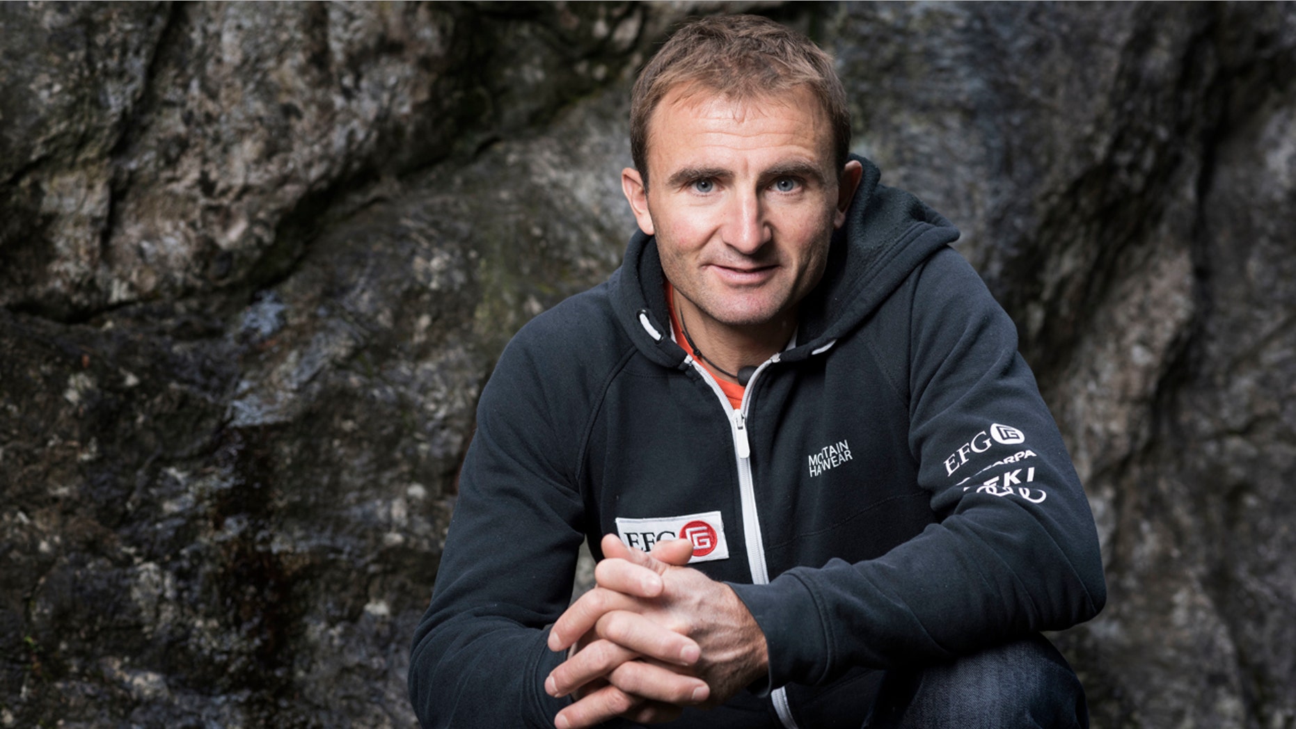 In this Sept. 11, 2015 file photo Swiss climber Ueli Steck poses for a photo at the foot of a climbing wall in Wilderswil, Canton of Berne, Switzerland.