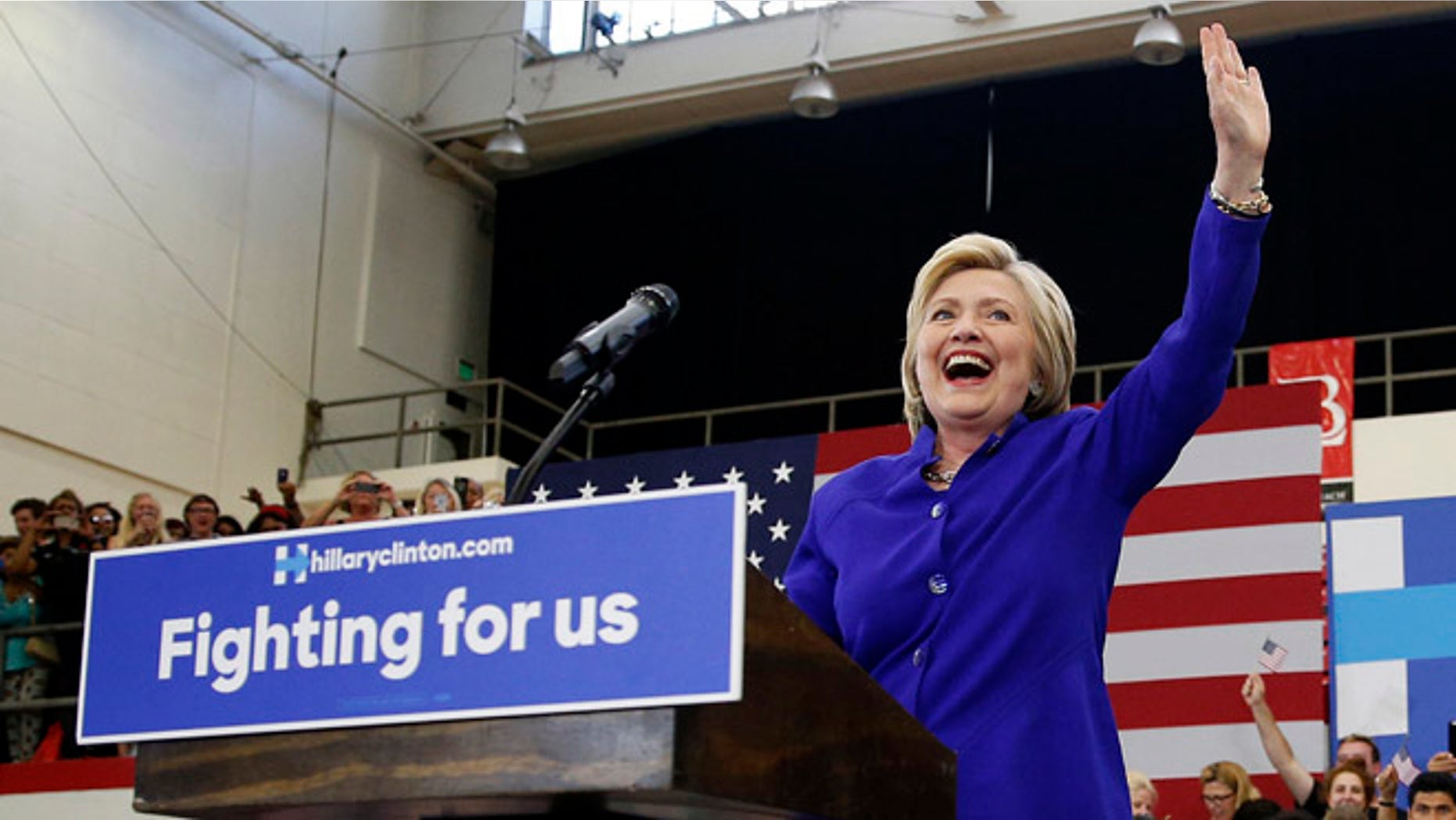 Hillary Clinton takes the stage at a rally, Monday, June 6, 2016, in Long Beach, Calif.