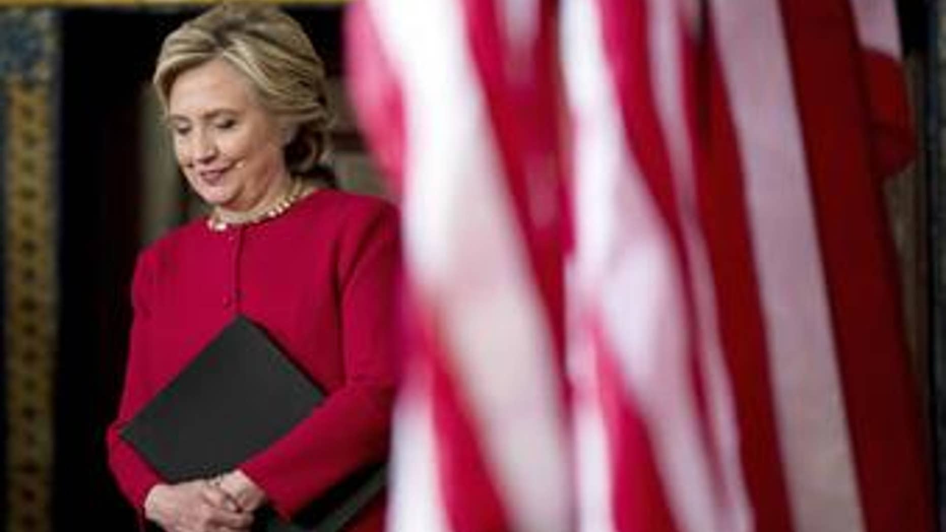 Democratic presidential candidate Hillary Clinton arrives to speak to members of the media after a rally at the Zembo Shrine in Harrisburg, Pa., on Oct. 4, 2016.